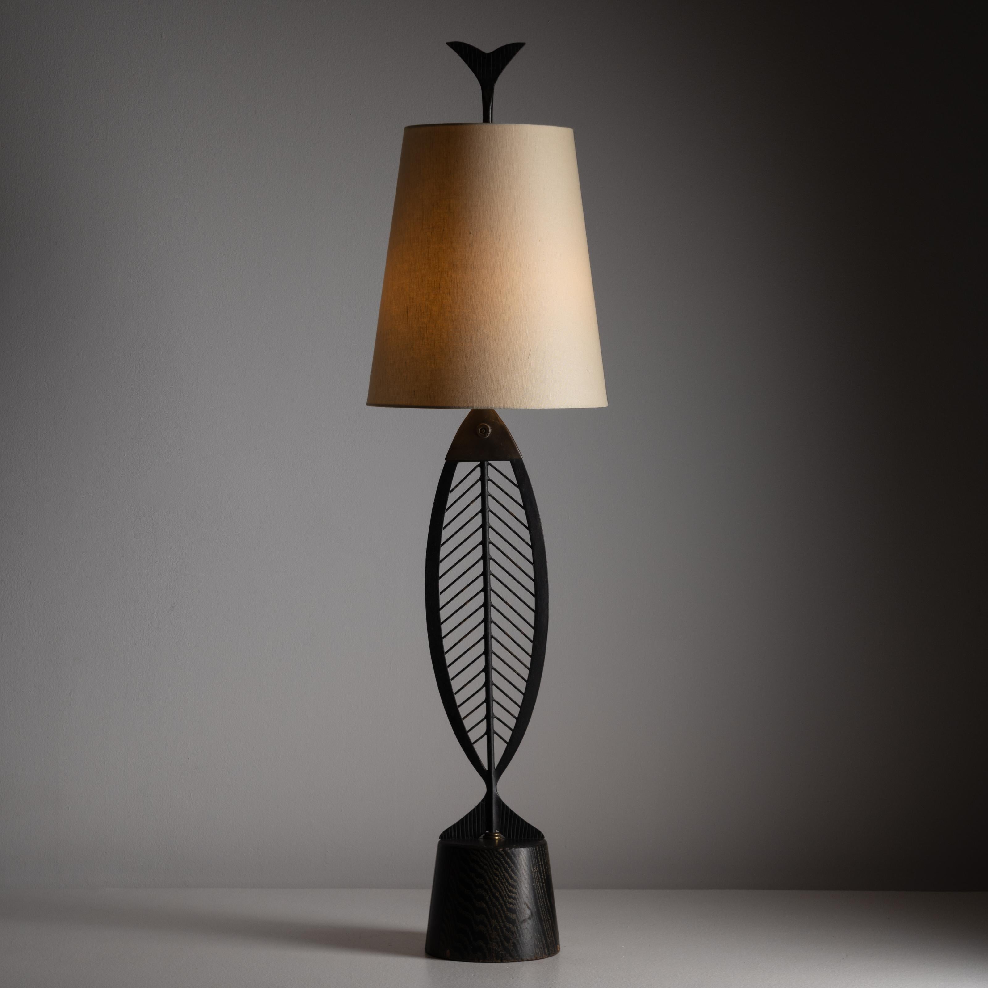 Monumental table lamp attributed to Heifetz. Manufactured and designed in the US somewhere within the mid-twentieth century. Iron, brass, cerused oak, and linen make up this large table lamp. Requires a single E26 socket type. We recommend one 75w