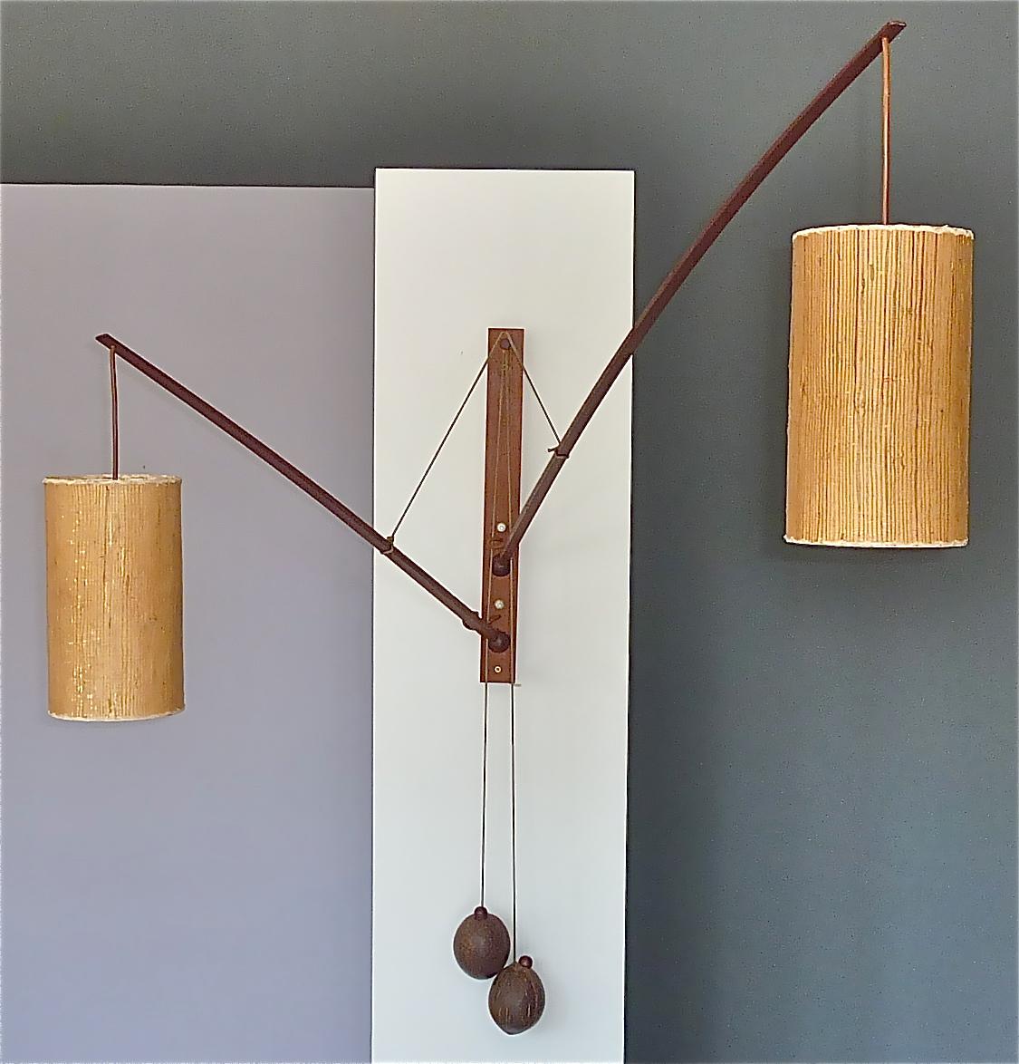 Monumental midcentury and super rare solid teak double wall light by Rupprecht Skrip, Germany circa 1950s to 1960s. Twice signed with Skrip Germany on top and Skrip Leuchte on reverse the very refined and adjustable midcentury wall light sculpture
