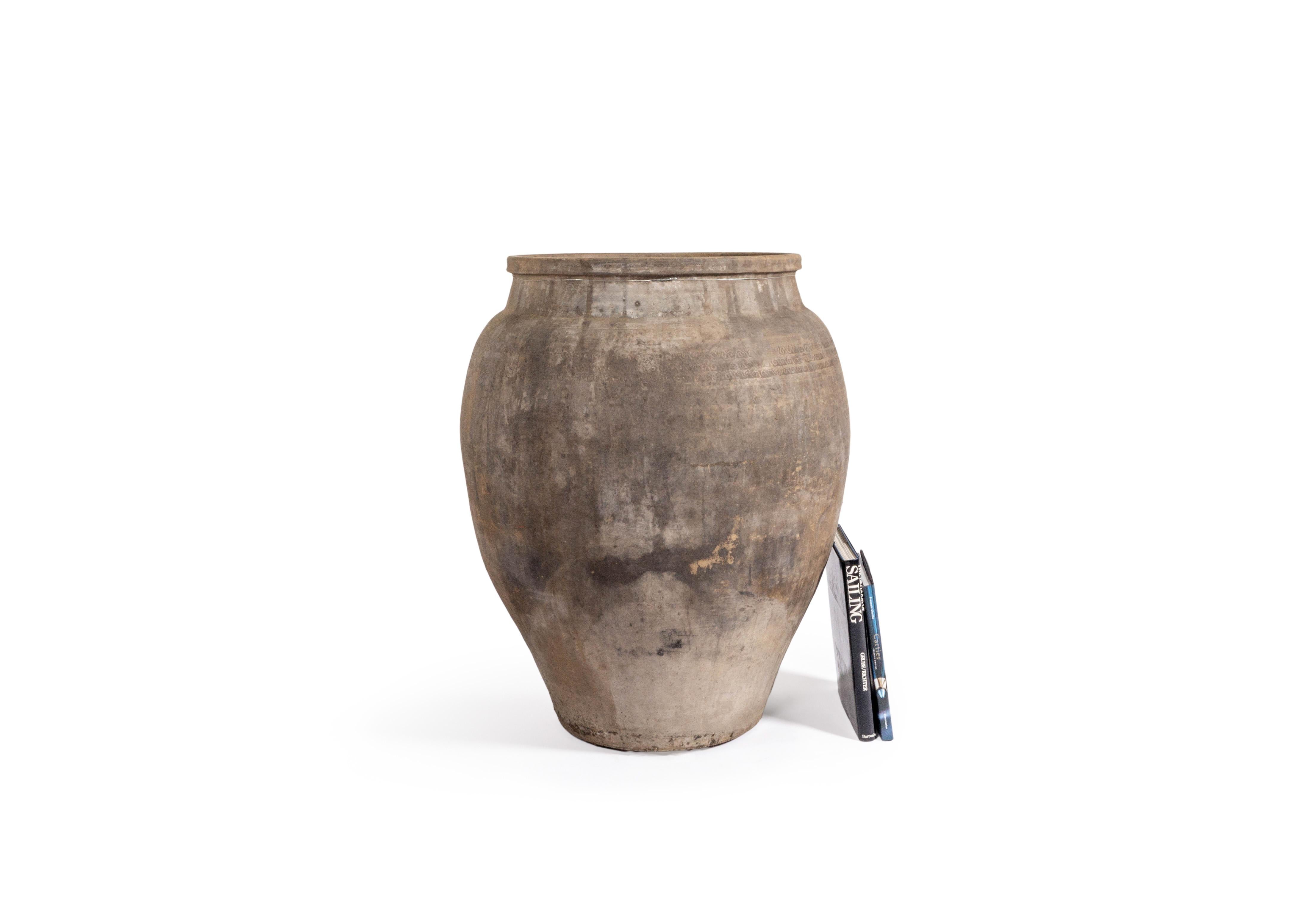 This monumental terra cotta storage jar features a beautiful charcoal color and one of a kind designed near the opening of the vessel. 

This piece is a part of Brendan Bass’s one-of-a-kind collection, Le Monde. French for “The World”, the Le