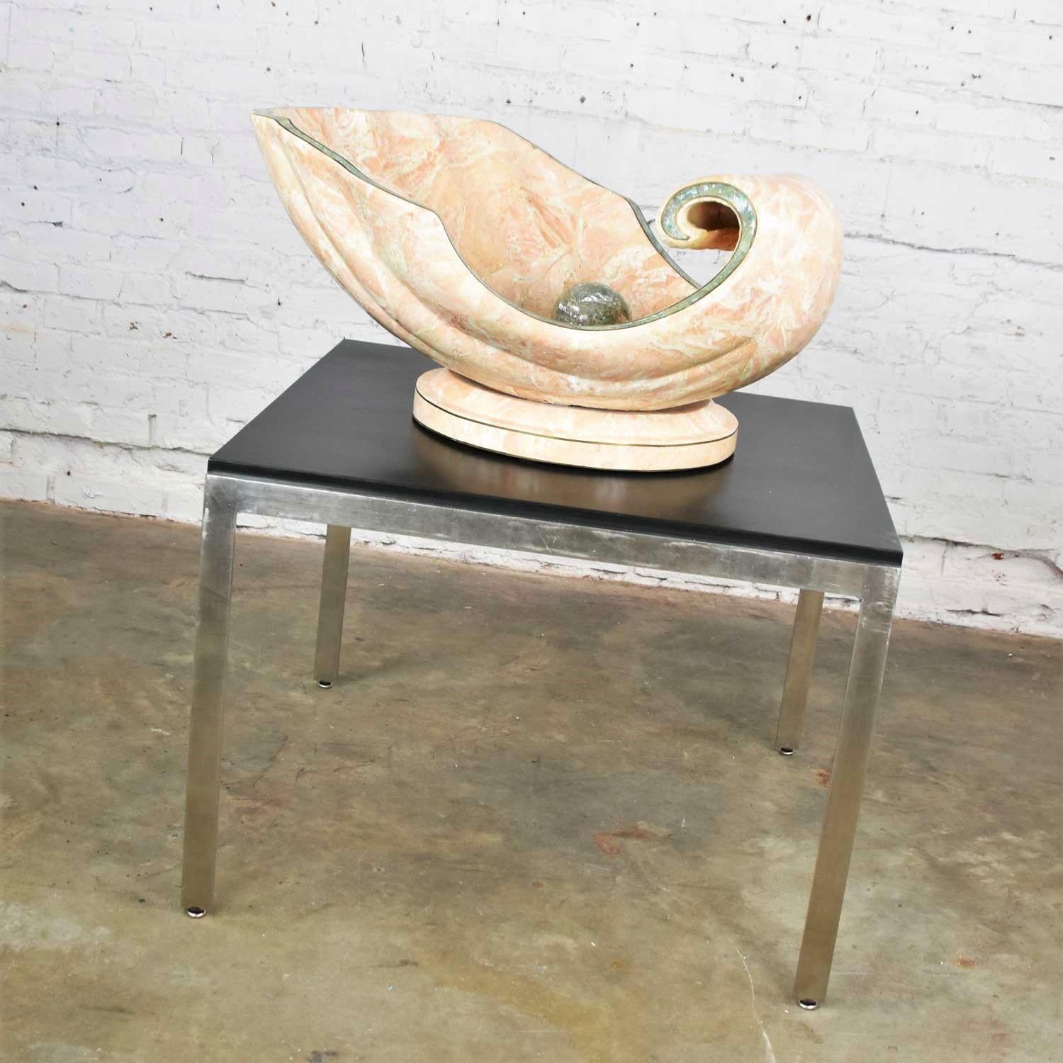 Incredible monumental tessellated marble clam shell with a giant pearl in its center used as a coffee table base with a 48-inch glass top with ogee edge. It is in wonderful vintage condition. It does have a small place where it has been restored