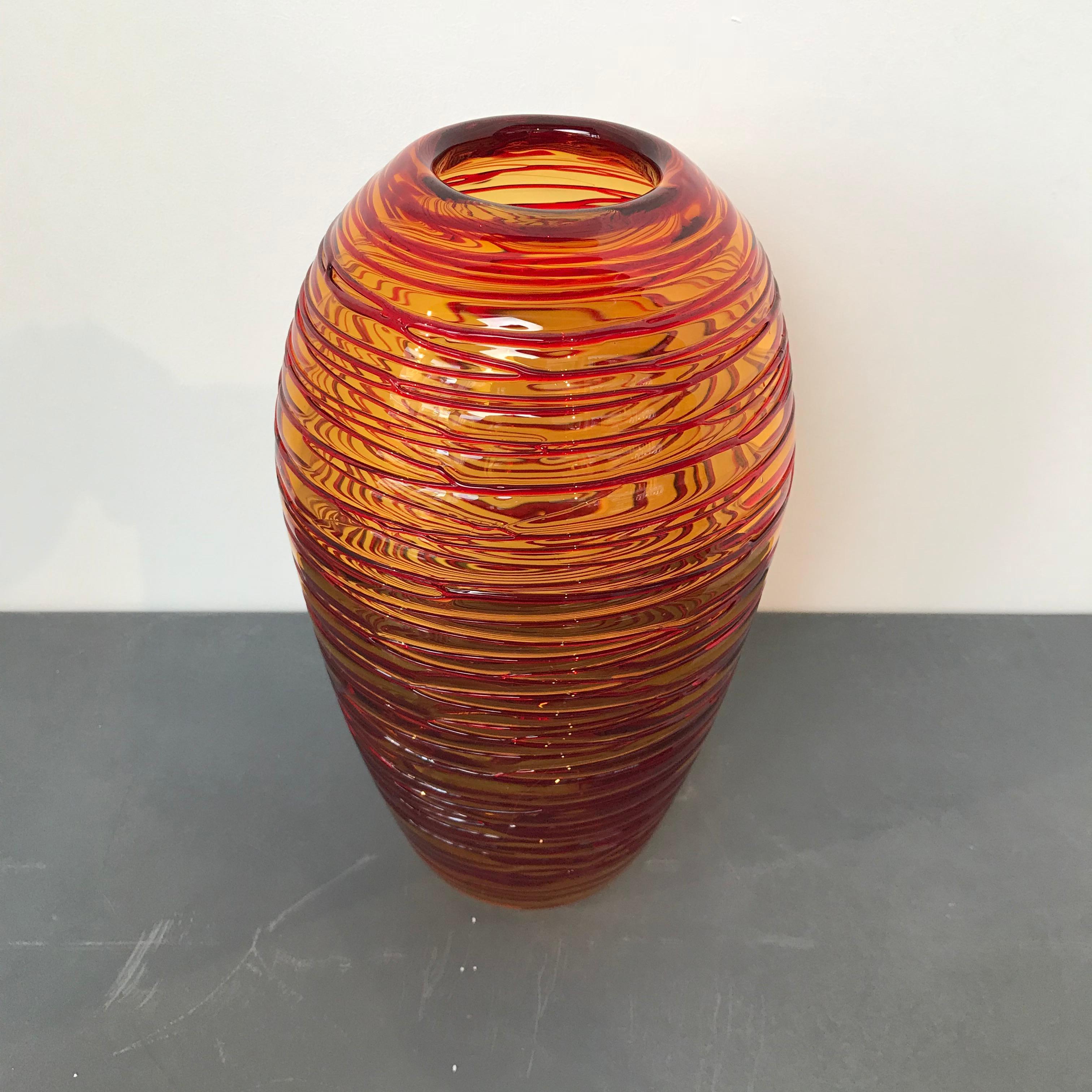 A beautiful amber-colored Murano glass vase with red threads, designed by Fulvio Bianconi (Italian, 1915-1996) for Venini, circa 1970, Italy. It is in excellent condition. Polished pontil. Unmarked like other similar Venini vases.
