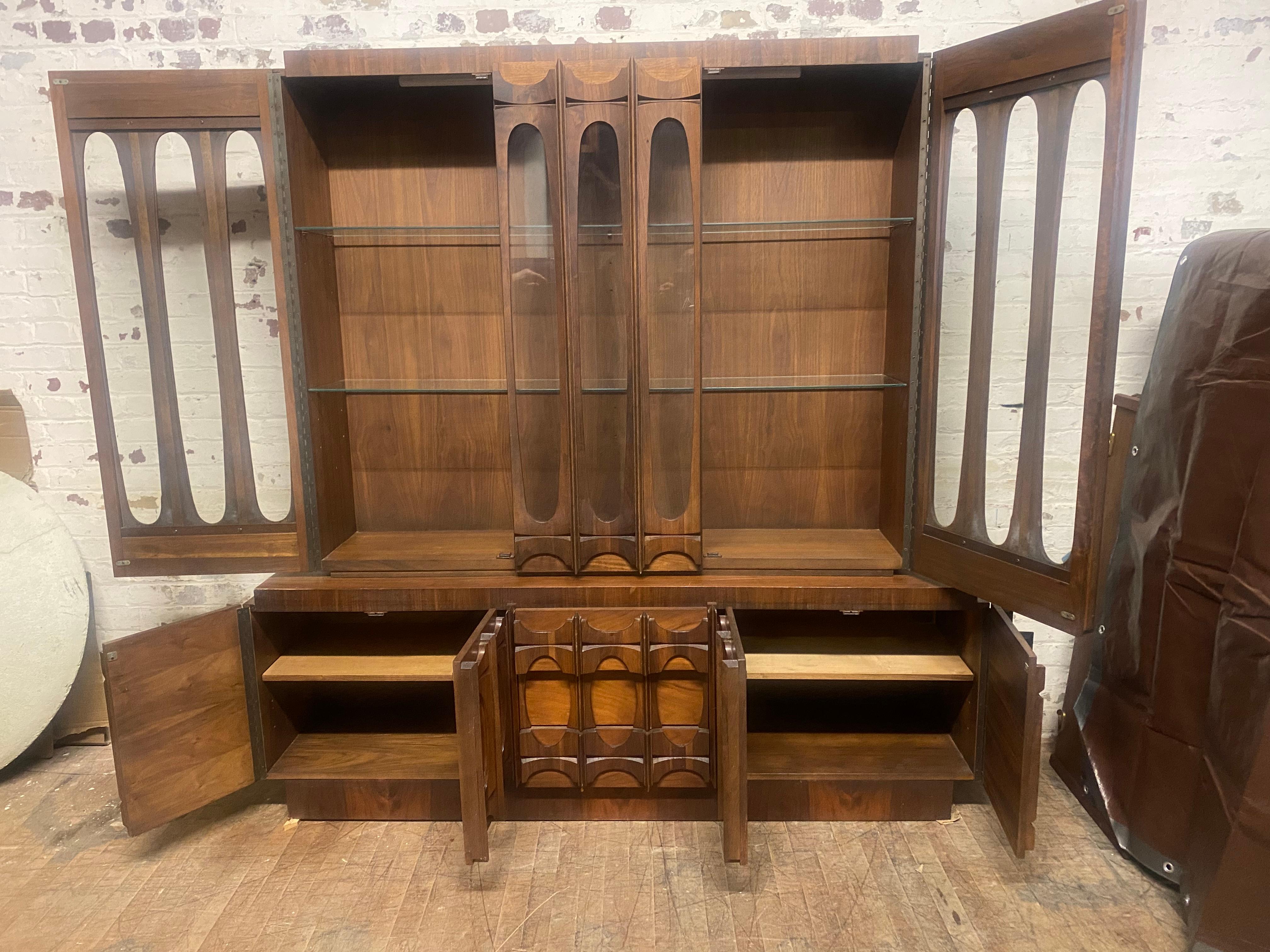 Tobago Brutalist Mid Century Canadian Walnut Buffet and Hutch,, Amazing design,, 2-piece,, credenza and china top.. Generous storage..Retains original finish,,patina,, minor veneer lose (backside),, hardly noticeable ,Hand delivery avail to New York