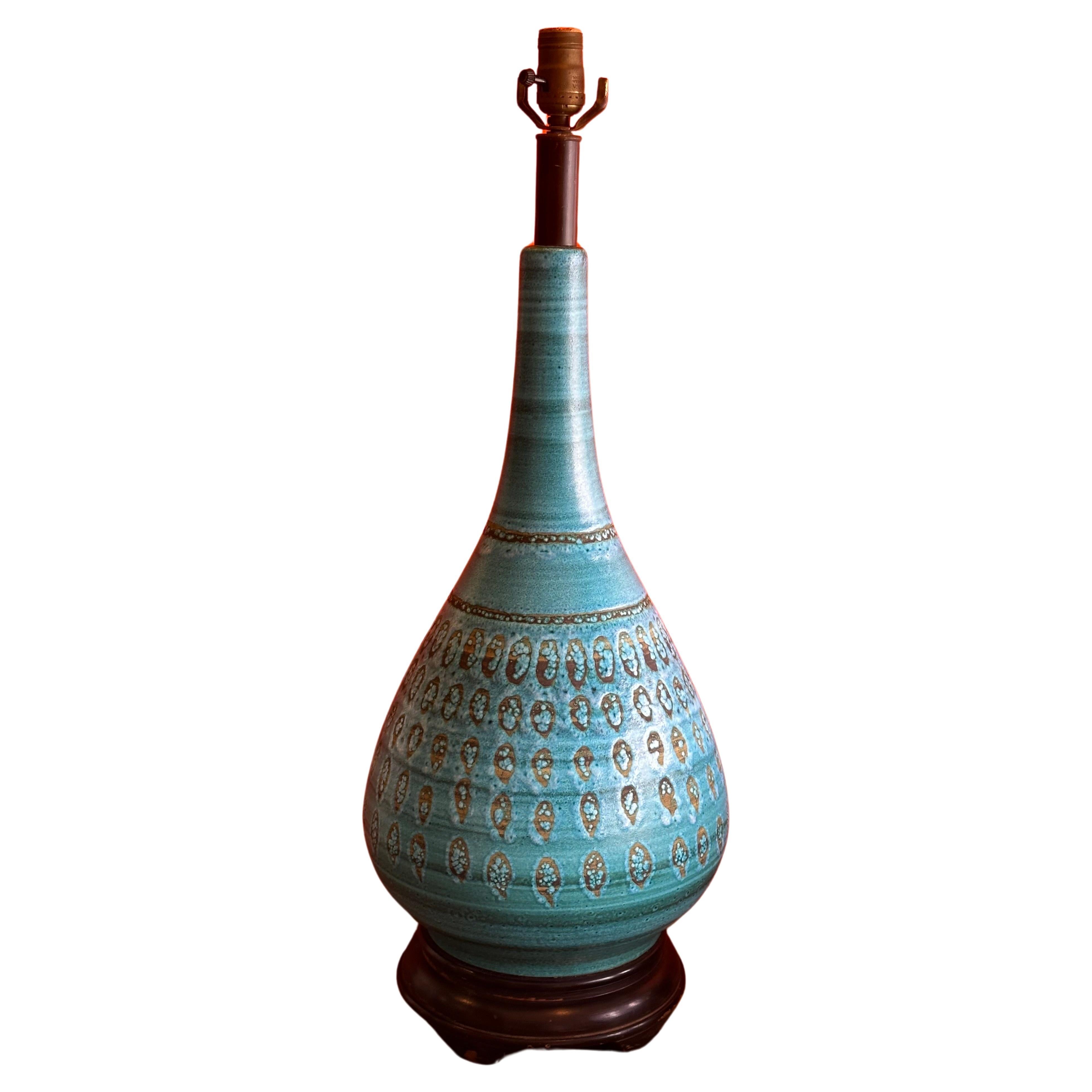 Monumental turquoise glazed ceramic lamp by Aldo Londi for Bitossi, circa 1960s.  The lamp is in very good working condition and measures 11.5