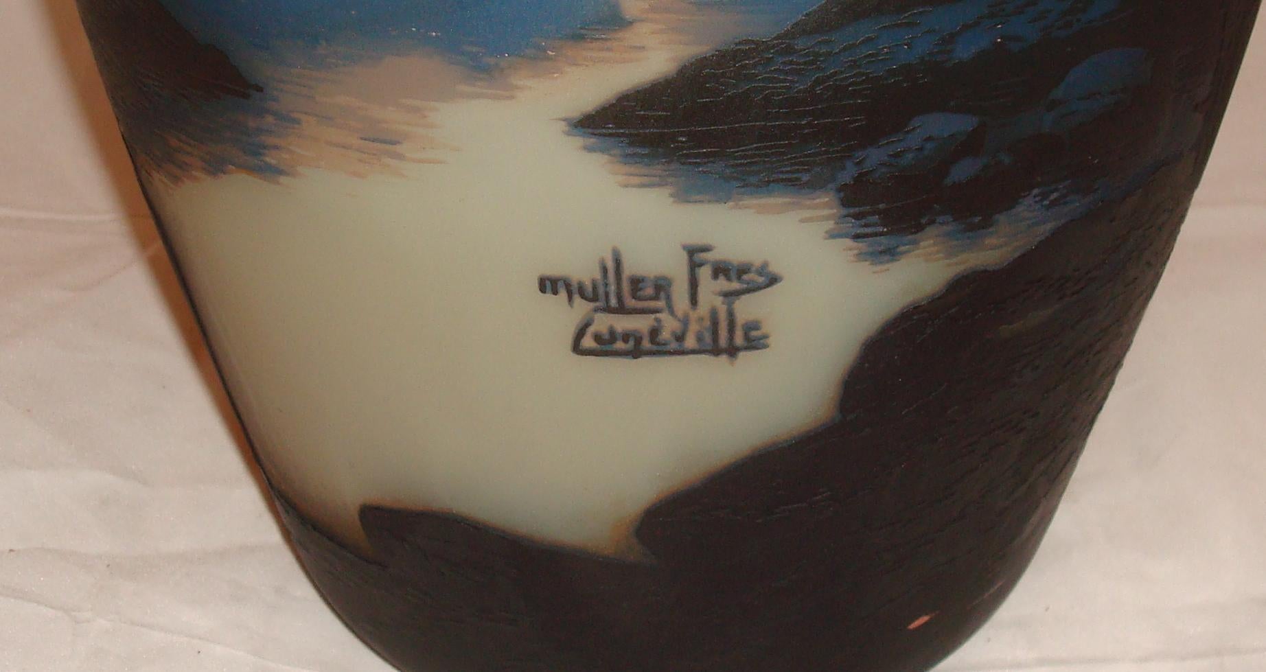 Vase Sign: Muller Fres Luneville
acid worked
Muller Feres
The heart of the company was formed by five brothers (Henri, Desire, Eugene, Pierre, Victor) from a glass making family who trained and worked at the Galle factory. Henri set up a decorating