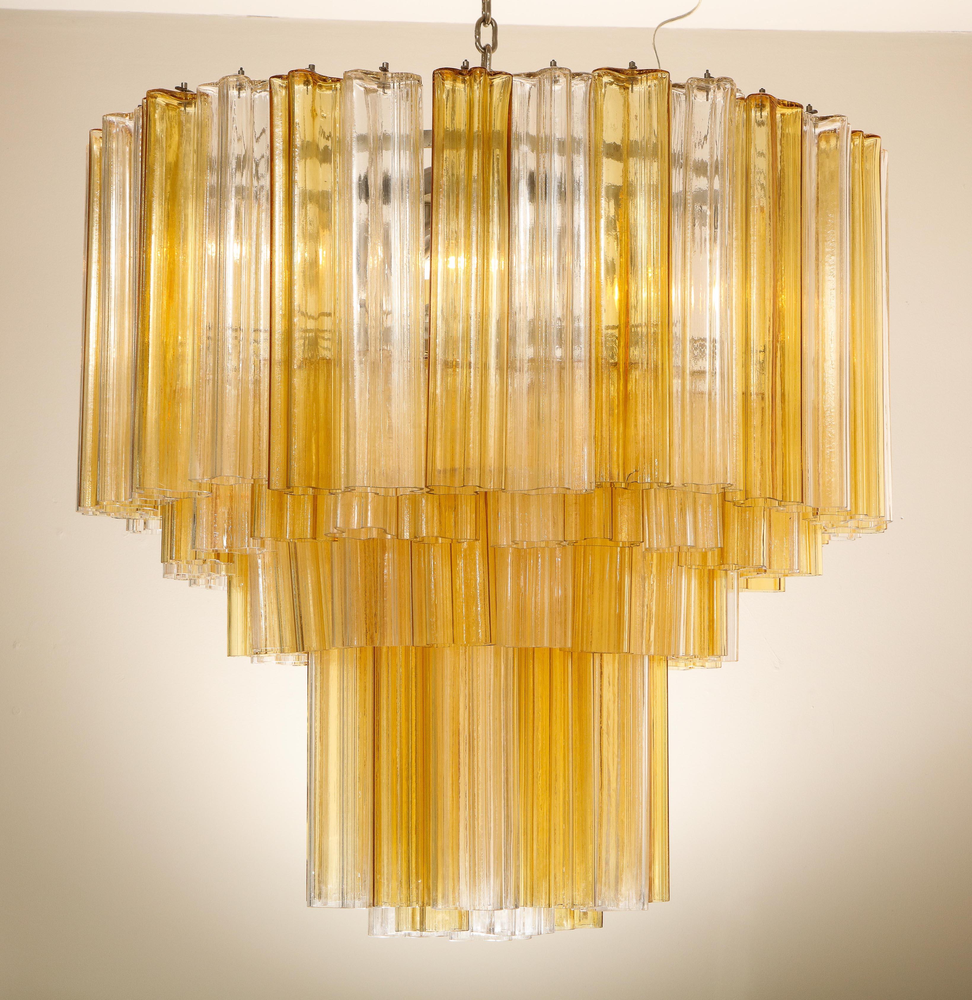 Monumental Venini tiered clear and amber Tronchi glass chandelier. Few glass pieces have minor chips or cracks. There are 20 sockets total.