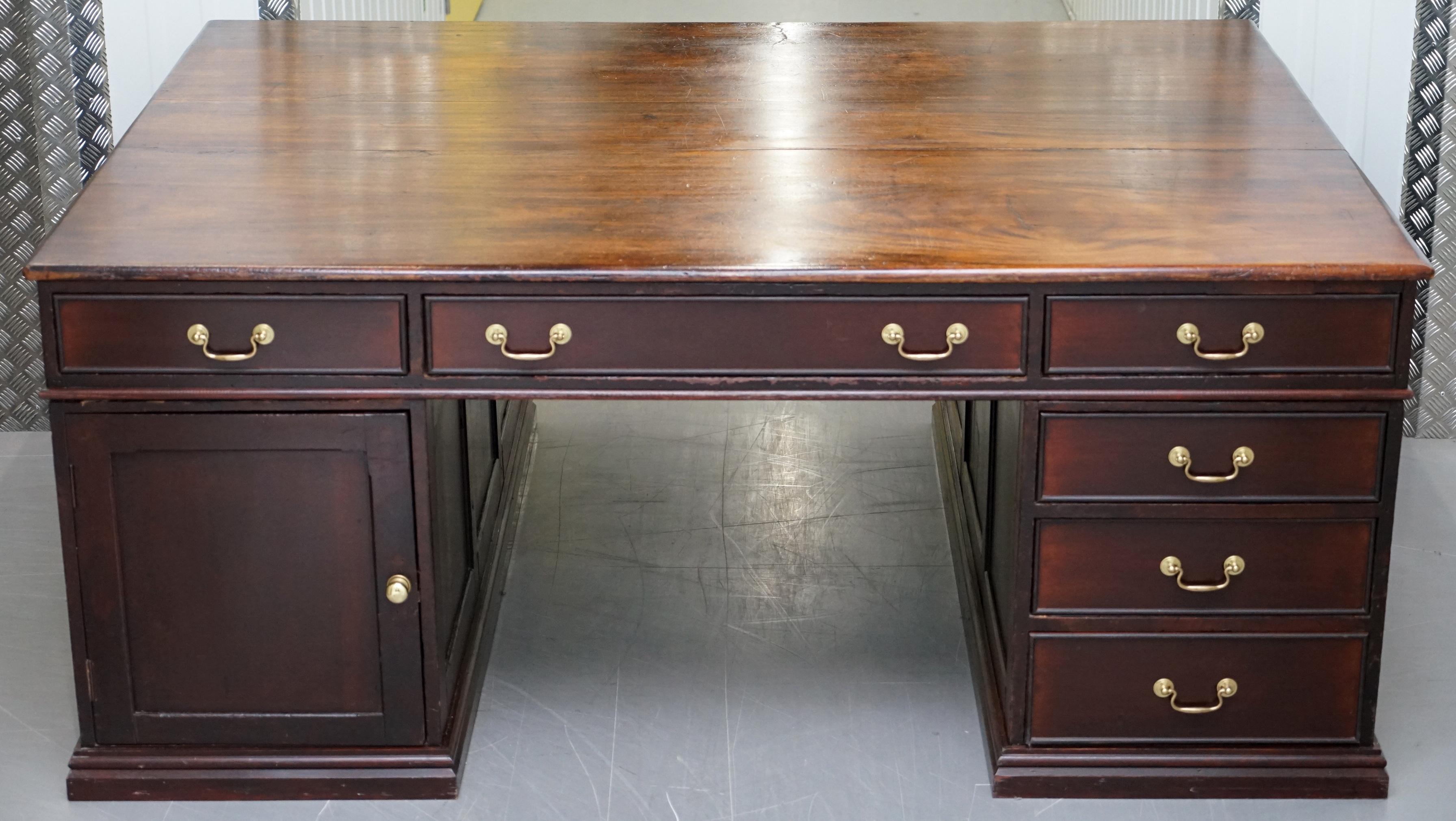 We are delighted to offer for sale this absolutely monumentally large Victorian twin pedestal 9 drawers 2 cupboards double sided mahogany partner desk.

This desk is massive, originally designed as you can see for two people to share, the depth of