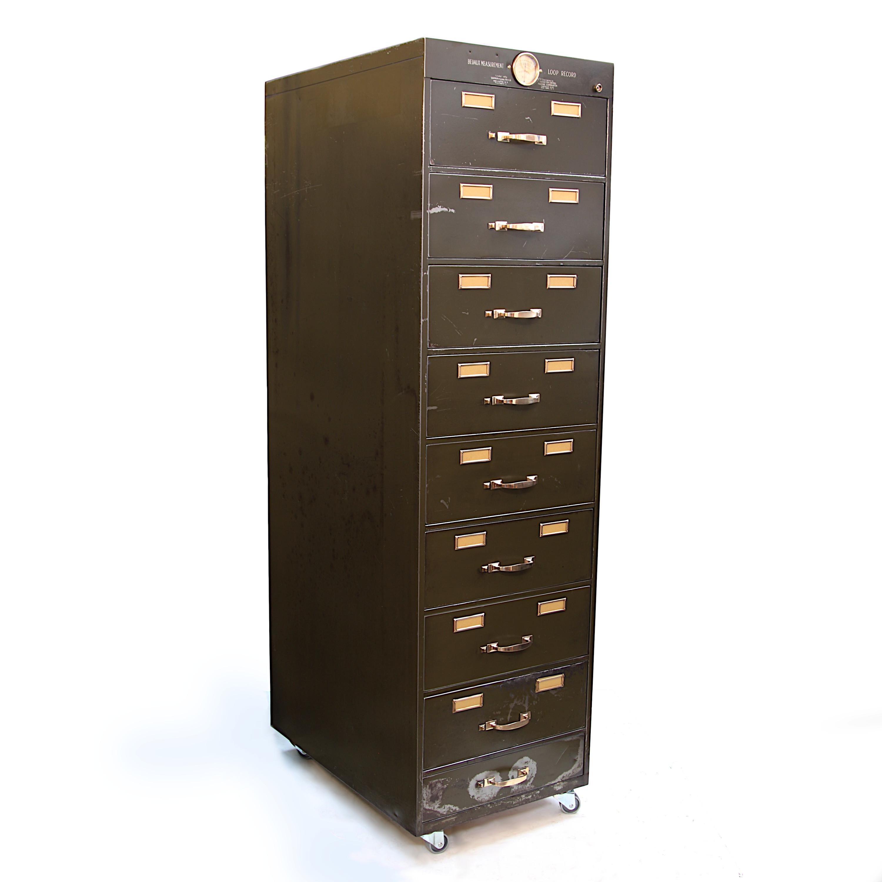 This unique file cabinet was originally built to house film reels as part of the 