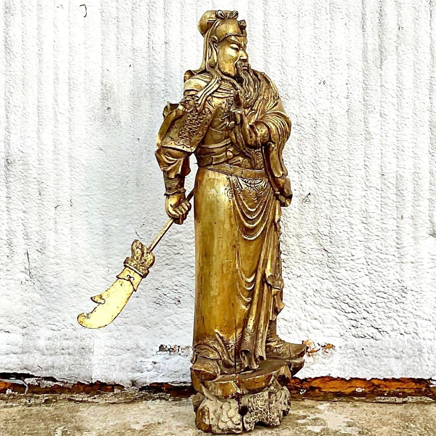 Fantastic vintage monumental golden warrior. Beautiful hand carved detail of the proud solider. Imagine the drama he would add to any room. Acquired from a Palm Beach estate.