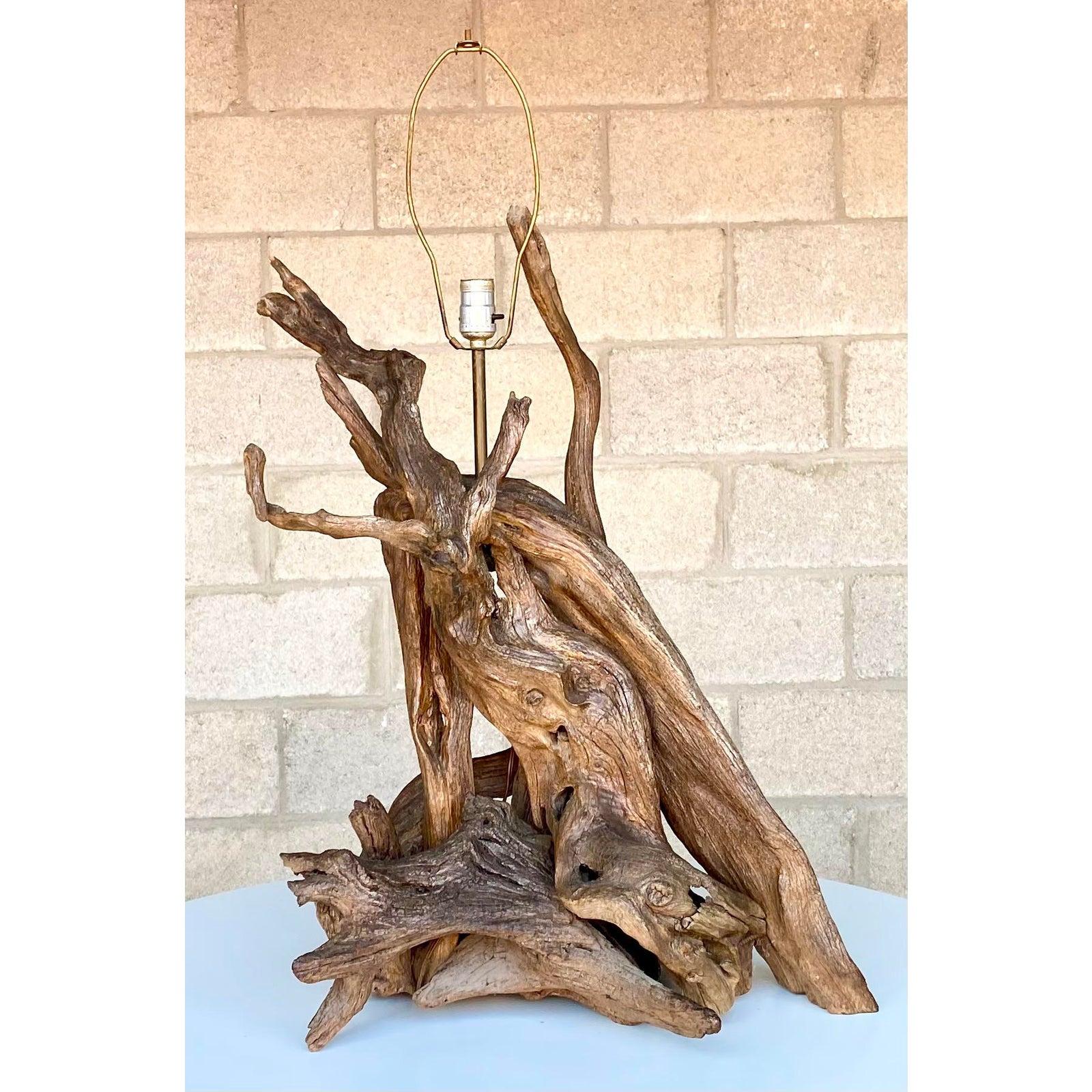 Incredible vintage driftwood lamp. Monumental in size and drama. A gnarly combination of twisted branches make up this impressive lamp. Acquired from a Palm Beach estate.
