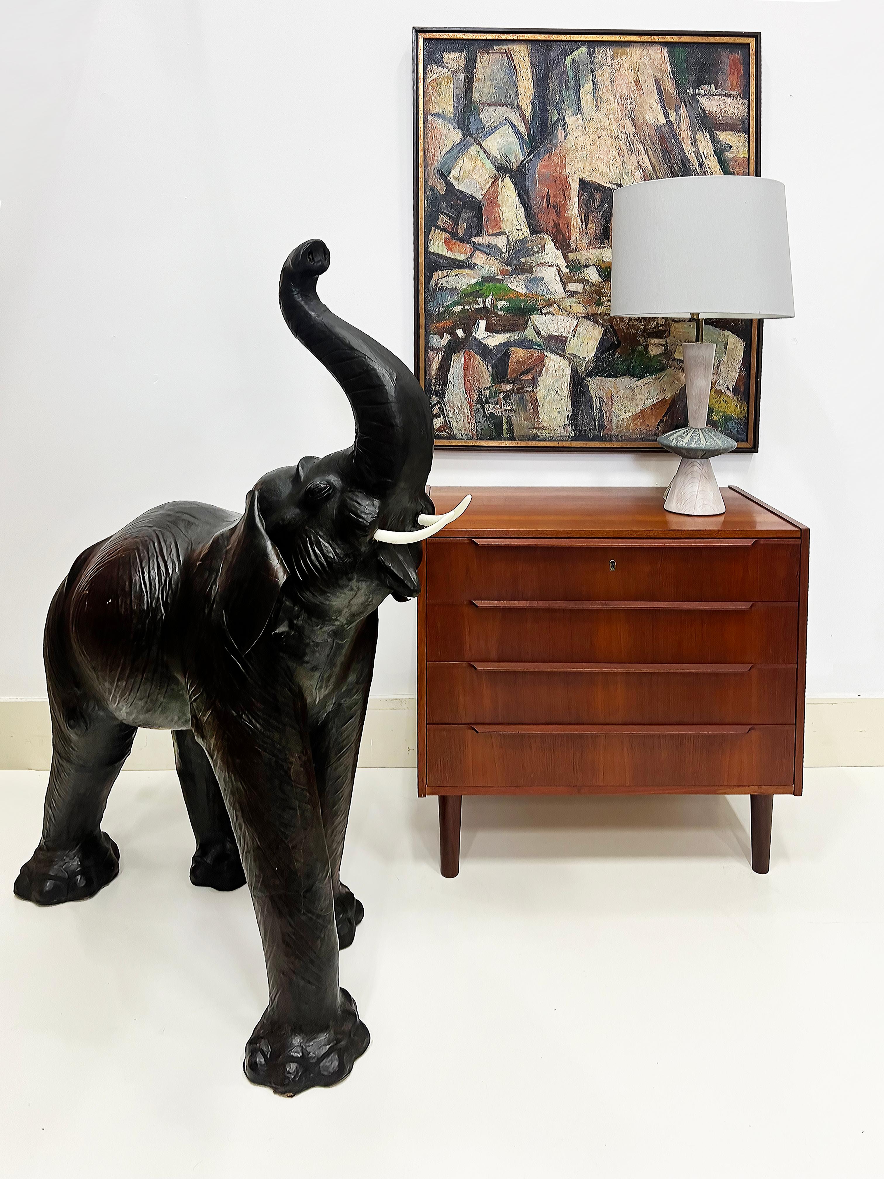 Monumental Vintage Hand- made Leather Elephant Sculpture

Offered for sale is a monumentally oversized robust decorative hand-made leather elephant sculpture with a great vintage patina. The sculpture is shown walking with the trunk up. The elephant