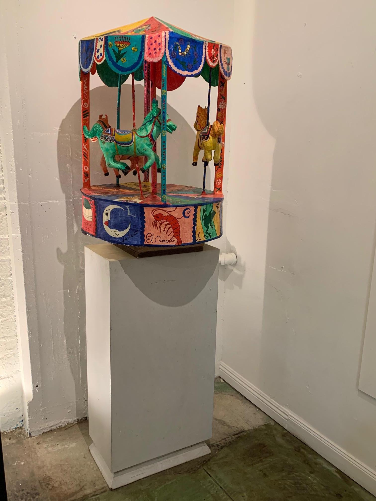 Monumental vintage figurative Mexican Folk Art carousel sculpture by Mexican artist Moises Rodriguez. Comprised out of papier-mâché the whimsical carousel sculpture highlights and emphasizes the importance of 
