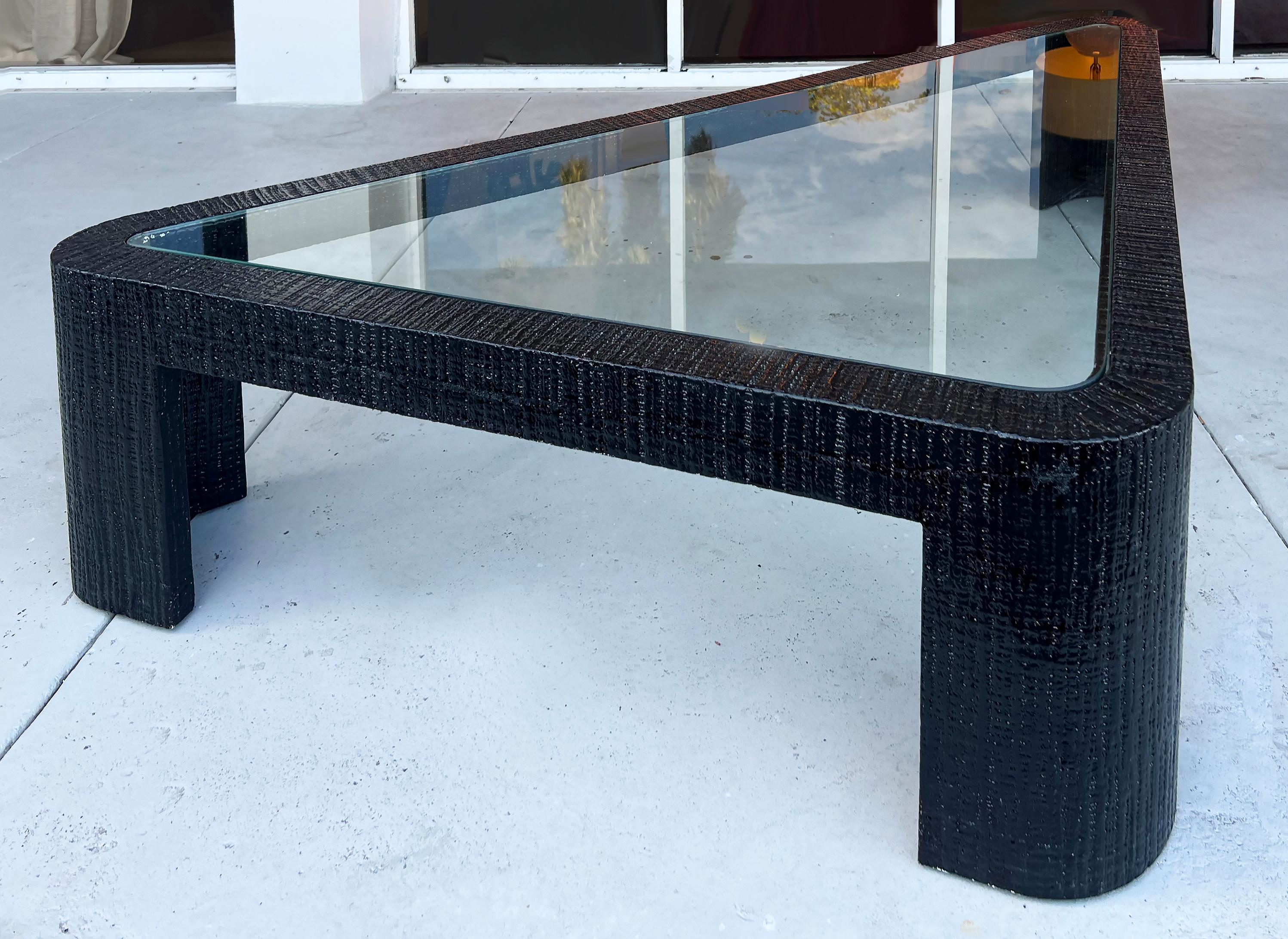 




Monumental Vintage Triangular Coffee Table, Ron Seff attributed

Offered for sale is a monumental coffee table shaped like an extended triangle attributed to Ron Seff. The table is clad in a textured finish indicative of painted grass-cloth.
