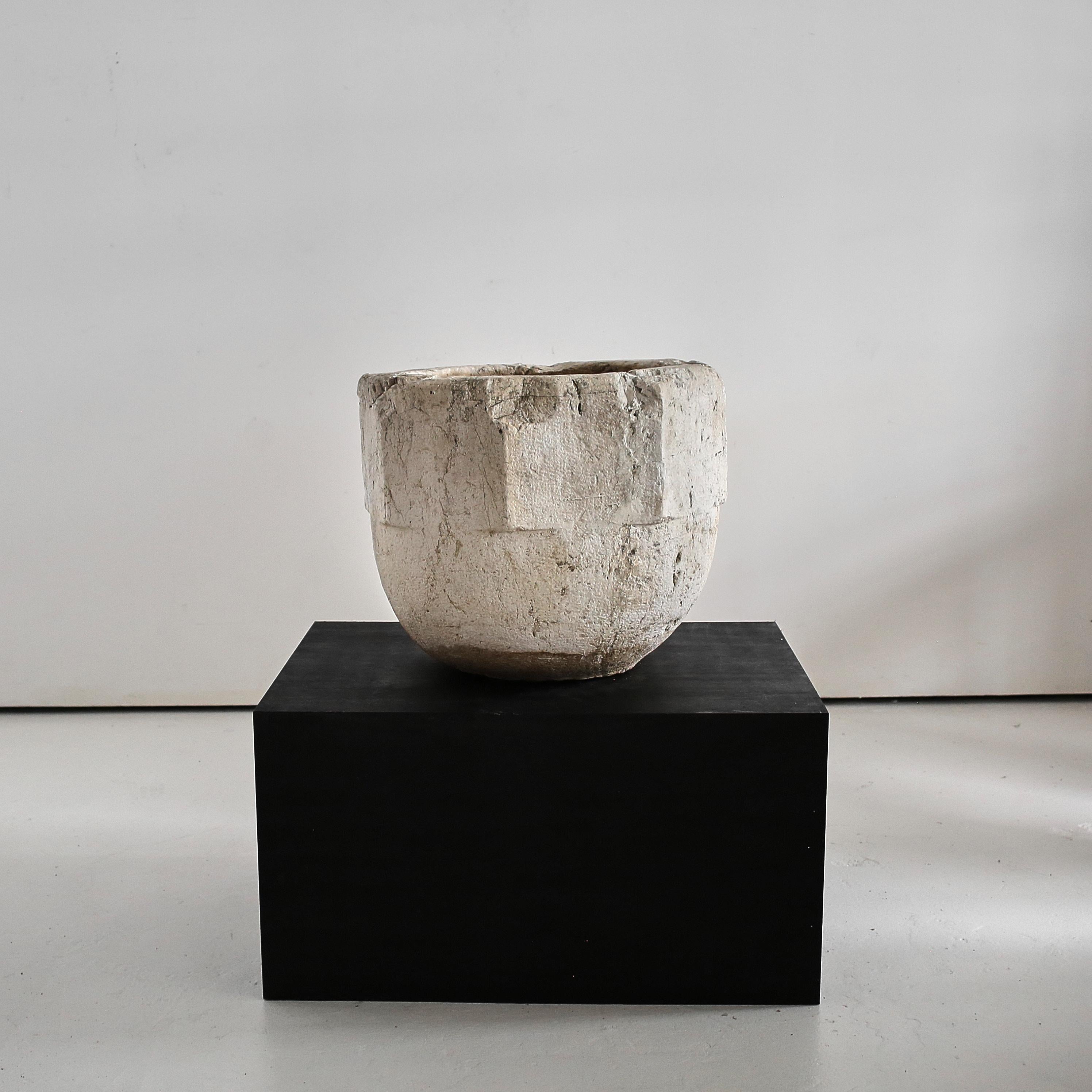 A rare sculptural XXXL 17th C. Stone mortar from the city of Venice.

Heavily, heavily patinated ancient white stone with many age old repairs & unusual carved octagonal design.

Both practical as a planter or purely sculptural.
