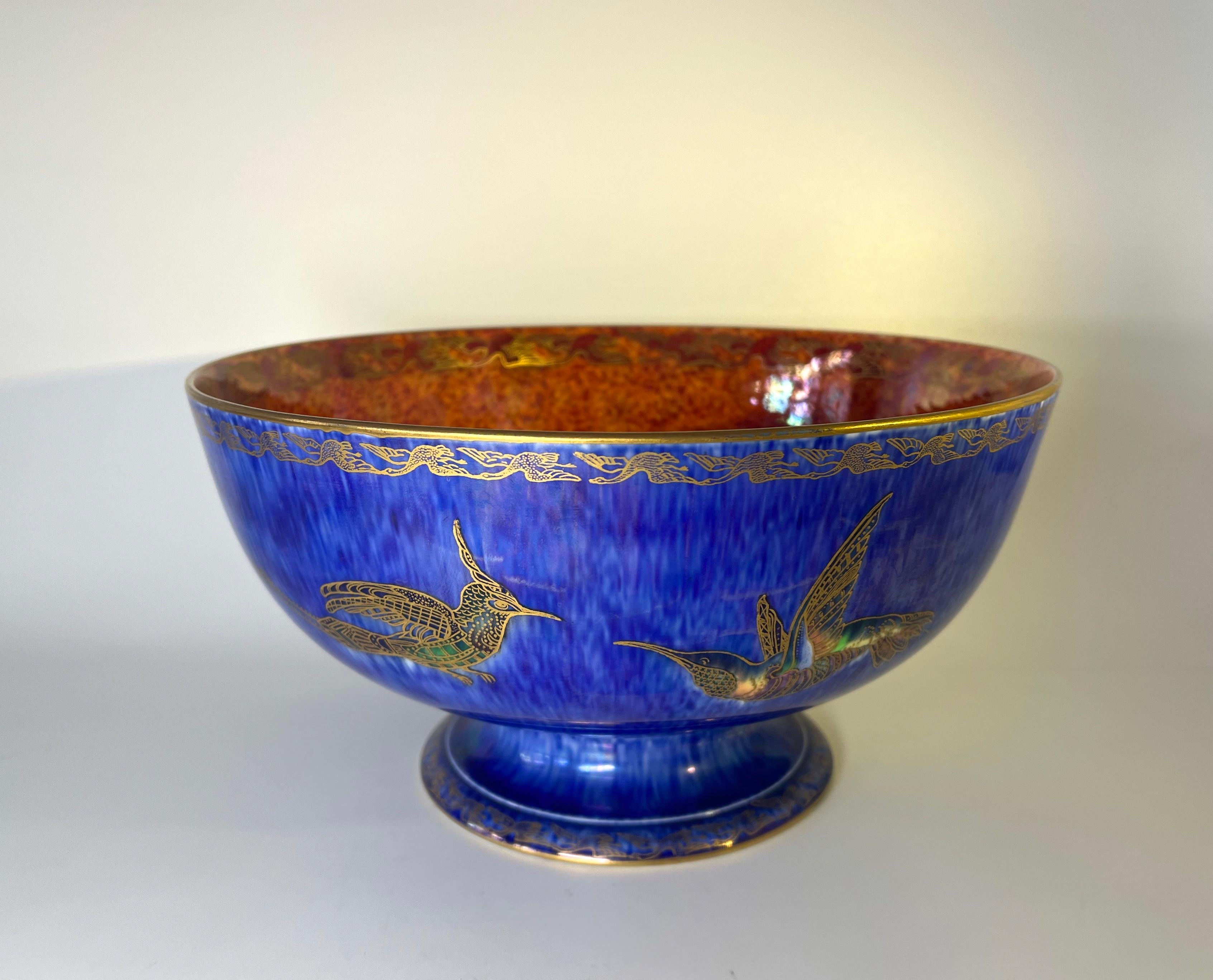 Imposing and monumental Wedgwood footed bowl by Daisy Makes-Jones of the Ordinary Lustre Series 
Superbly vibrant blue mottled ground decorated with hand painted and gilded exotic birds
The inner bowl graduates from deep orange to pomegranate red