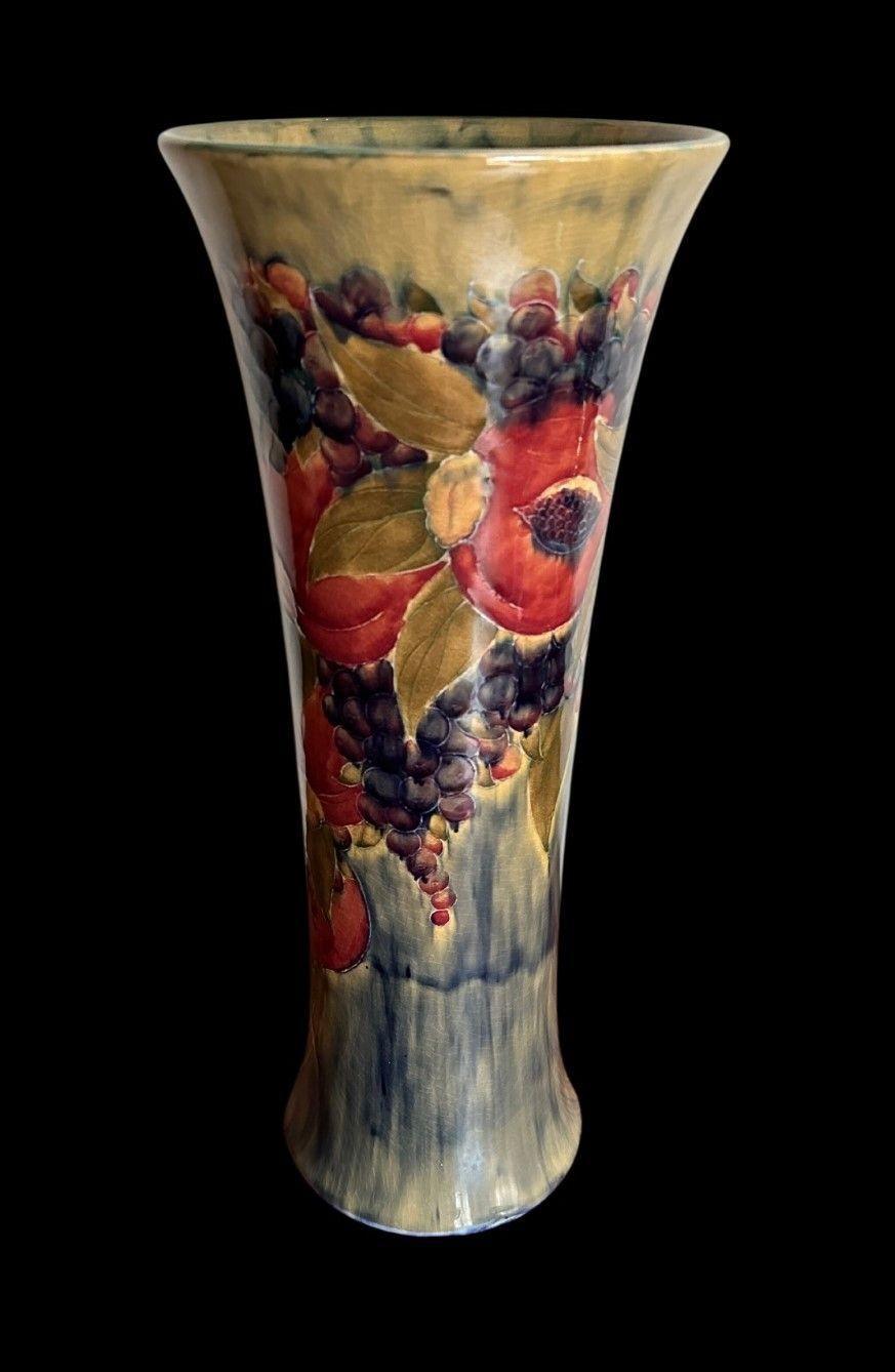 5387
William Moorcroft, a huge, exhibition quality Vase in the Pomegranate design on a Caledon Ground
Dated 1912
42.5cm high, 18cm wide
Ex Albert Wade collection