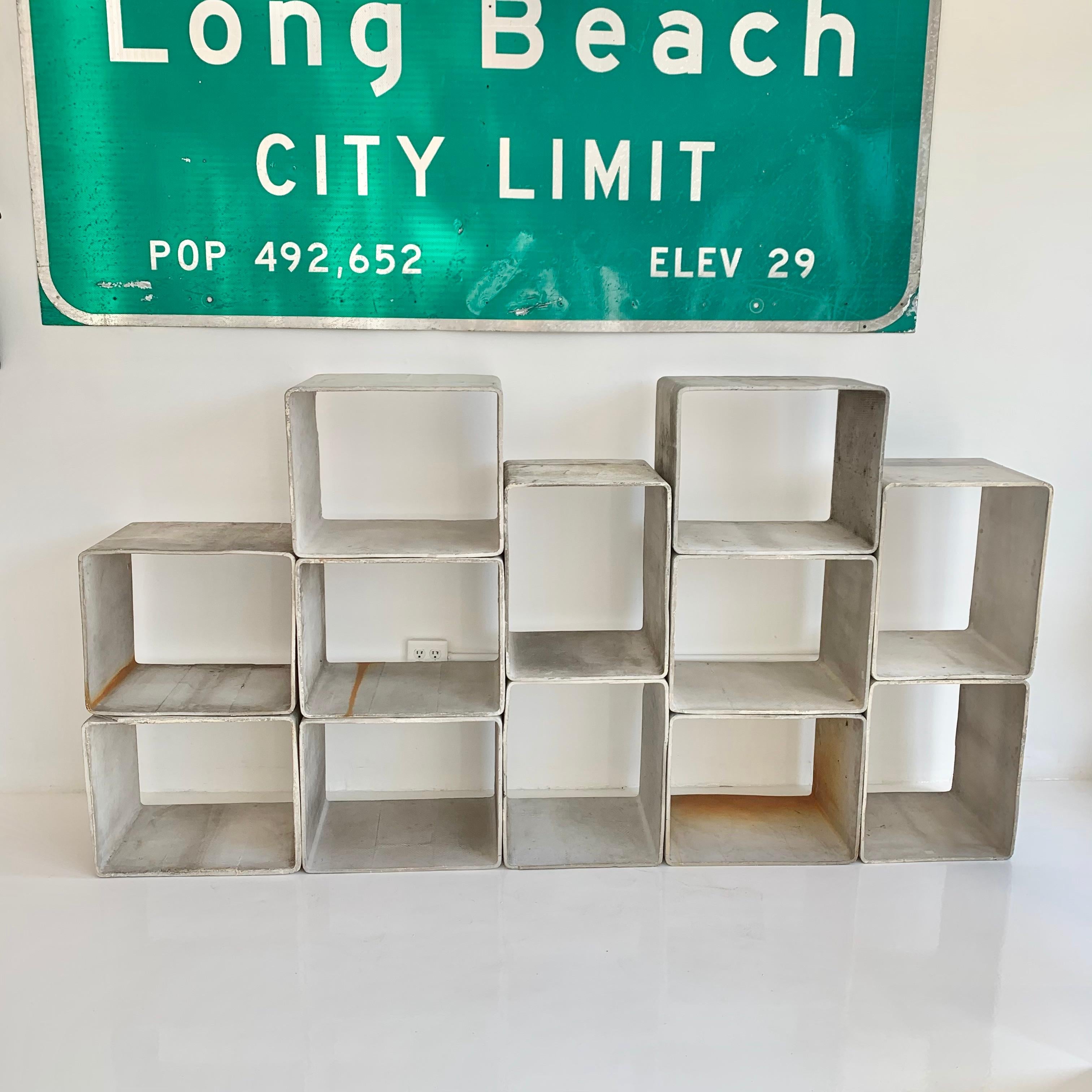 Massive set of concrete cubes by Swiss architect and designer Willy Guhl. Handmade in the early 1960s in Switzerland. Produced by Eternit. Set of 12 cubes in great original condition. Can be arranged in a multitude of ways. Perfect bookcase, room