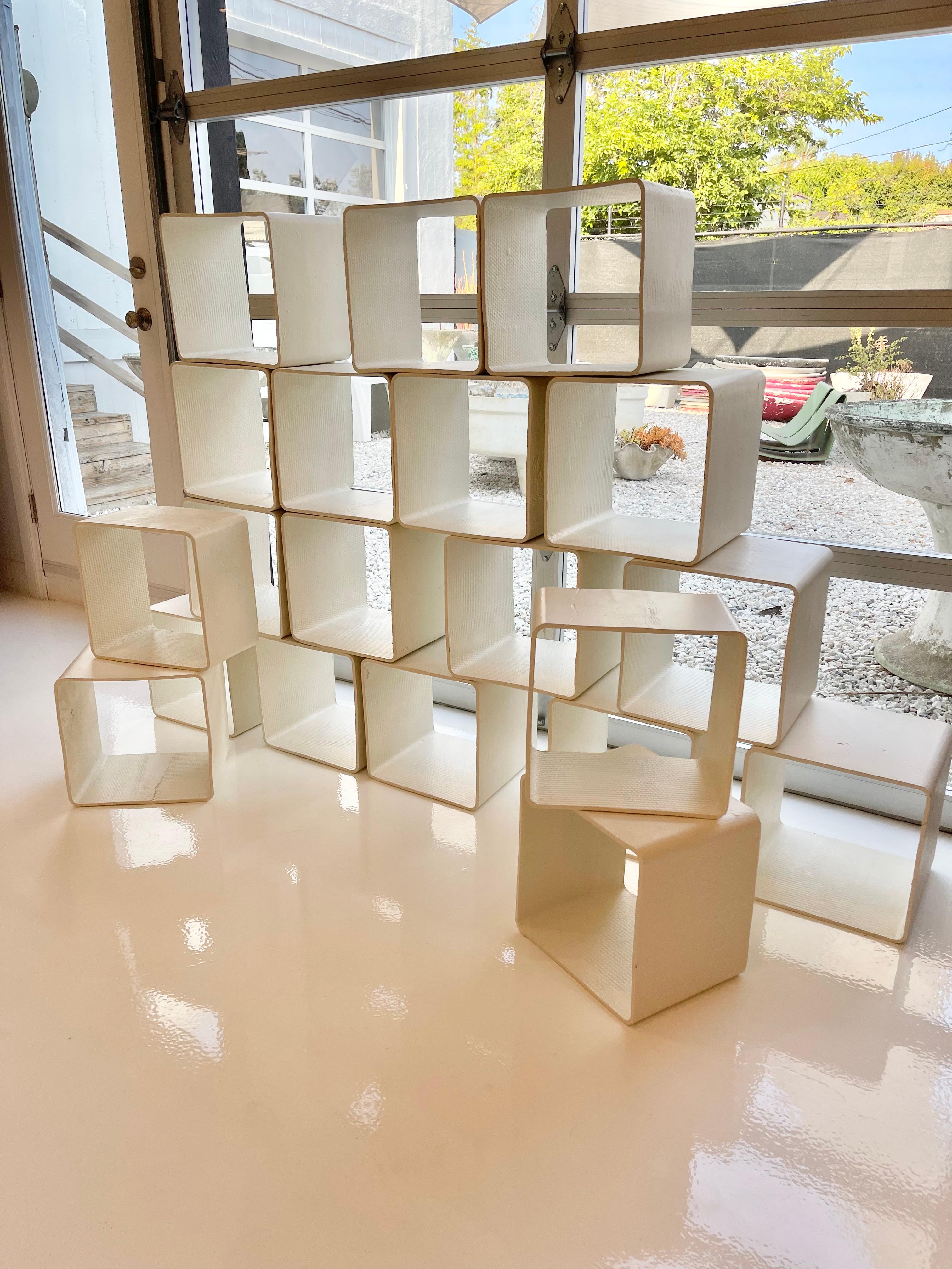 Massive bookcase comprised of 20 concrete cubes by Swiss architect and designer Willy Guhl, handmade in the early 1960s in Switzerland. Produced by Eternit. Set of 20 cubes in great original condition. Can be arranged in a multitude of ways. Perfect