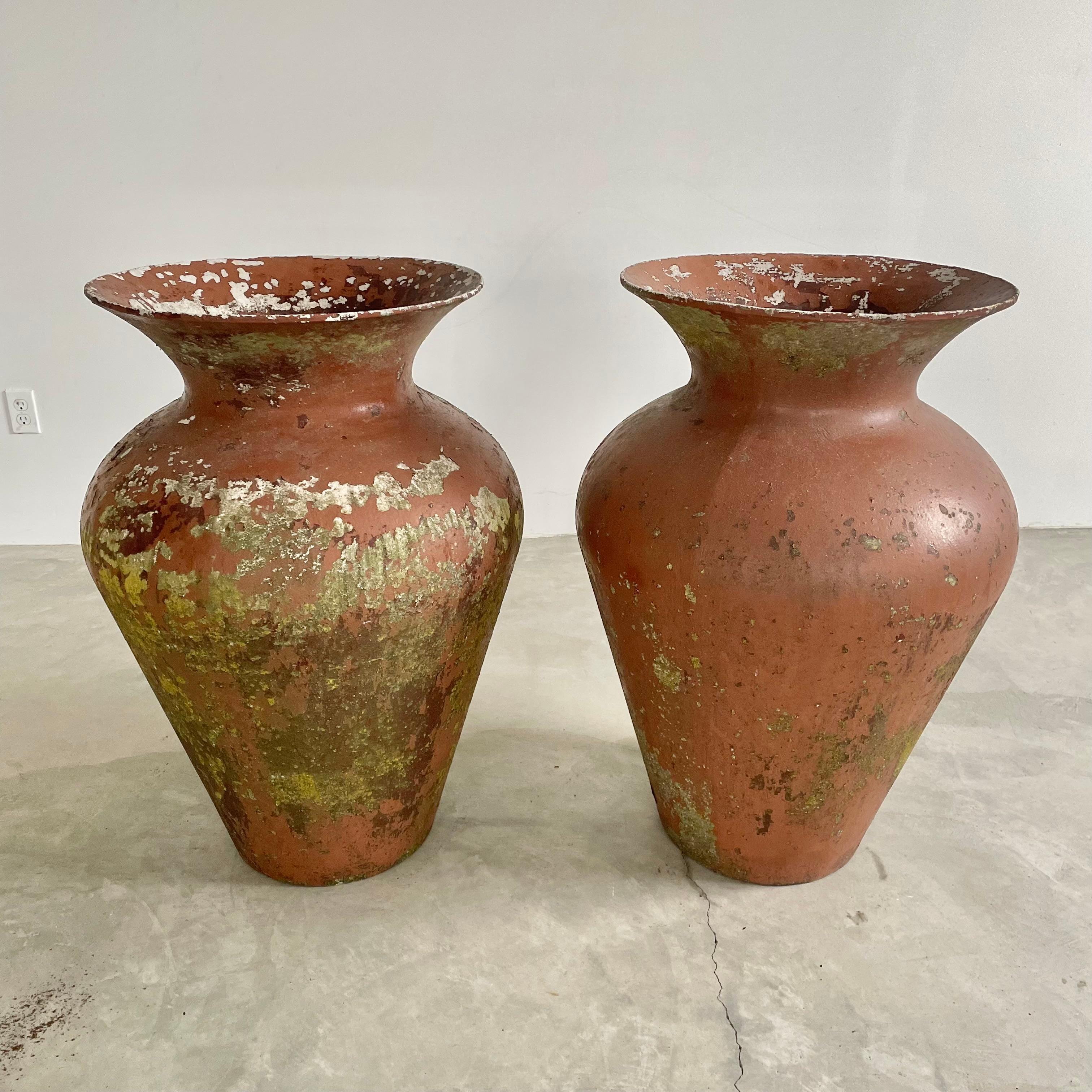 Immense concrete vase by Willy Guhl in an adobe patina. Extremely rare model. Made of fiber cement. Decades of patina, moss and paint. Colors vary from adobe and white to green and dark brown. Absolutely stunning presence with impeccable design and