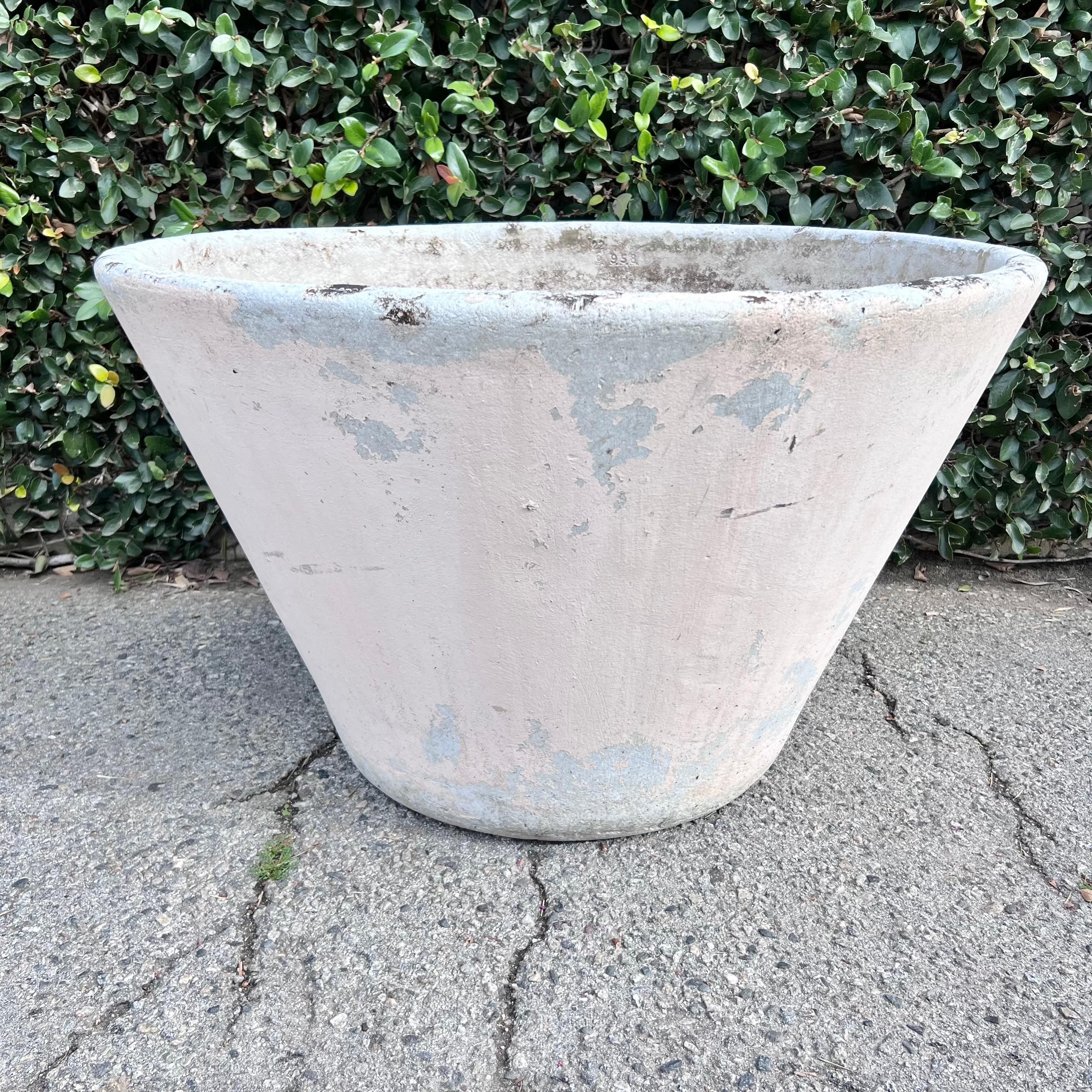 Massive concrete tree planters by Willy Guhl. Stunning size and color. Largest sized Willy Guhl planters ever made. Peach paint from years ago with natural patina. Able to plant a large sized tree. Great vintage condition with wear and superficial