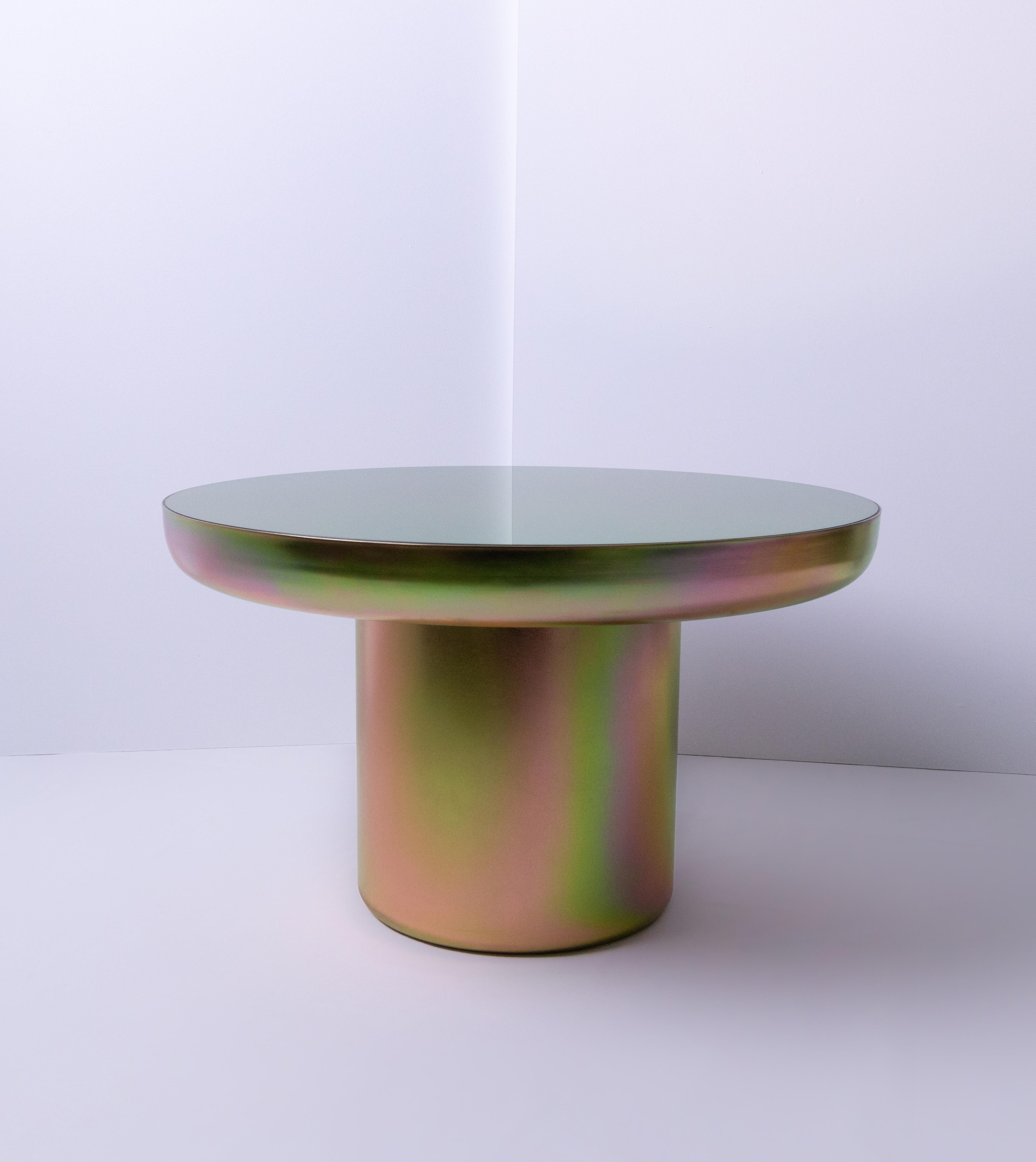 Mood Coffee Zinc is a visually light sculpturally strong table coated in a finish that elevates form and celebrates colour. The base is plated in a Zinc coating, a performative finish which allows the piece to reflect the colours and tones of its