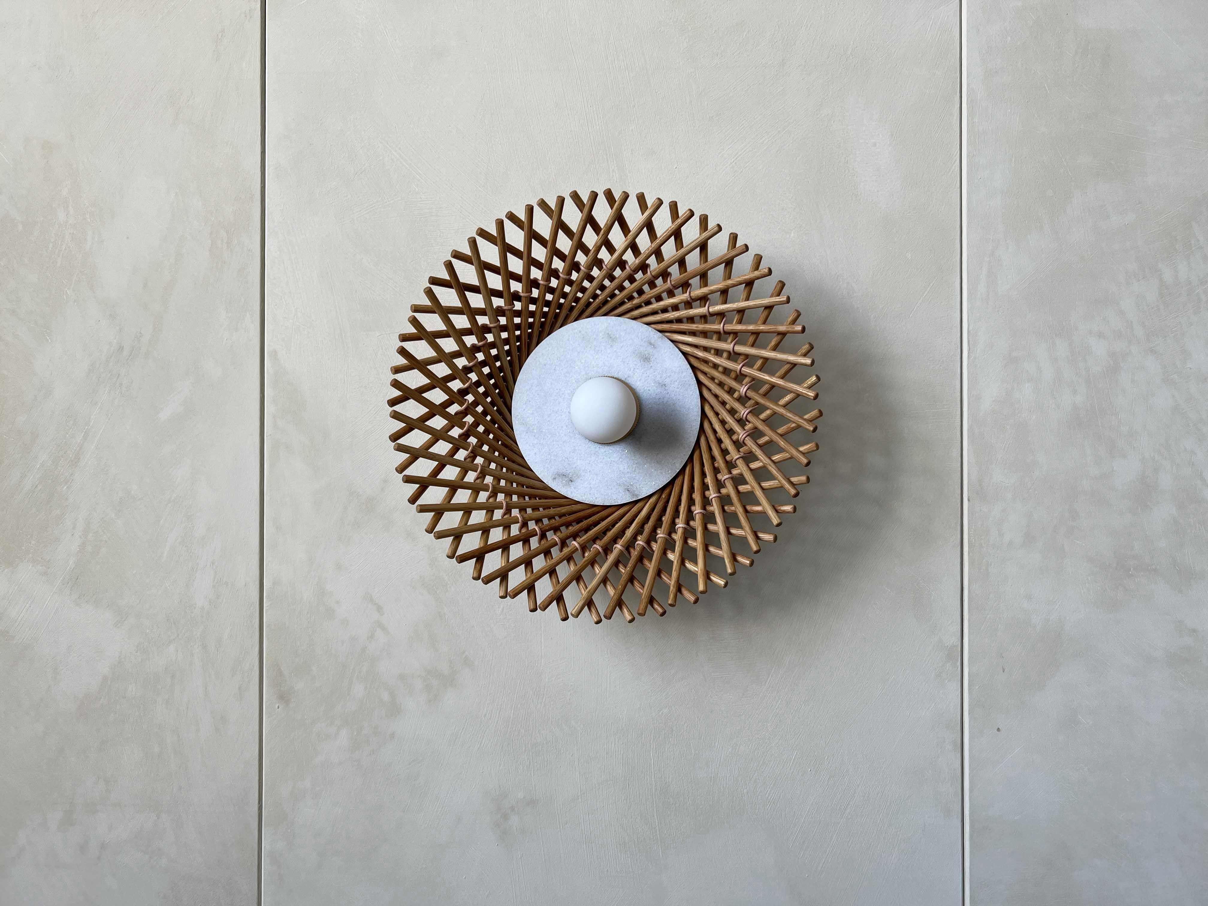 Playing with the interaction of light and geometry, the Mooda Sconces offer a contemporary lighting solution without being disconnected from its surroundings. When illuminated, the sconce throws a dramatic yet gentle shadow onto the wall, filling