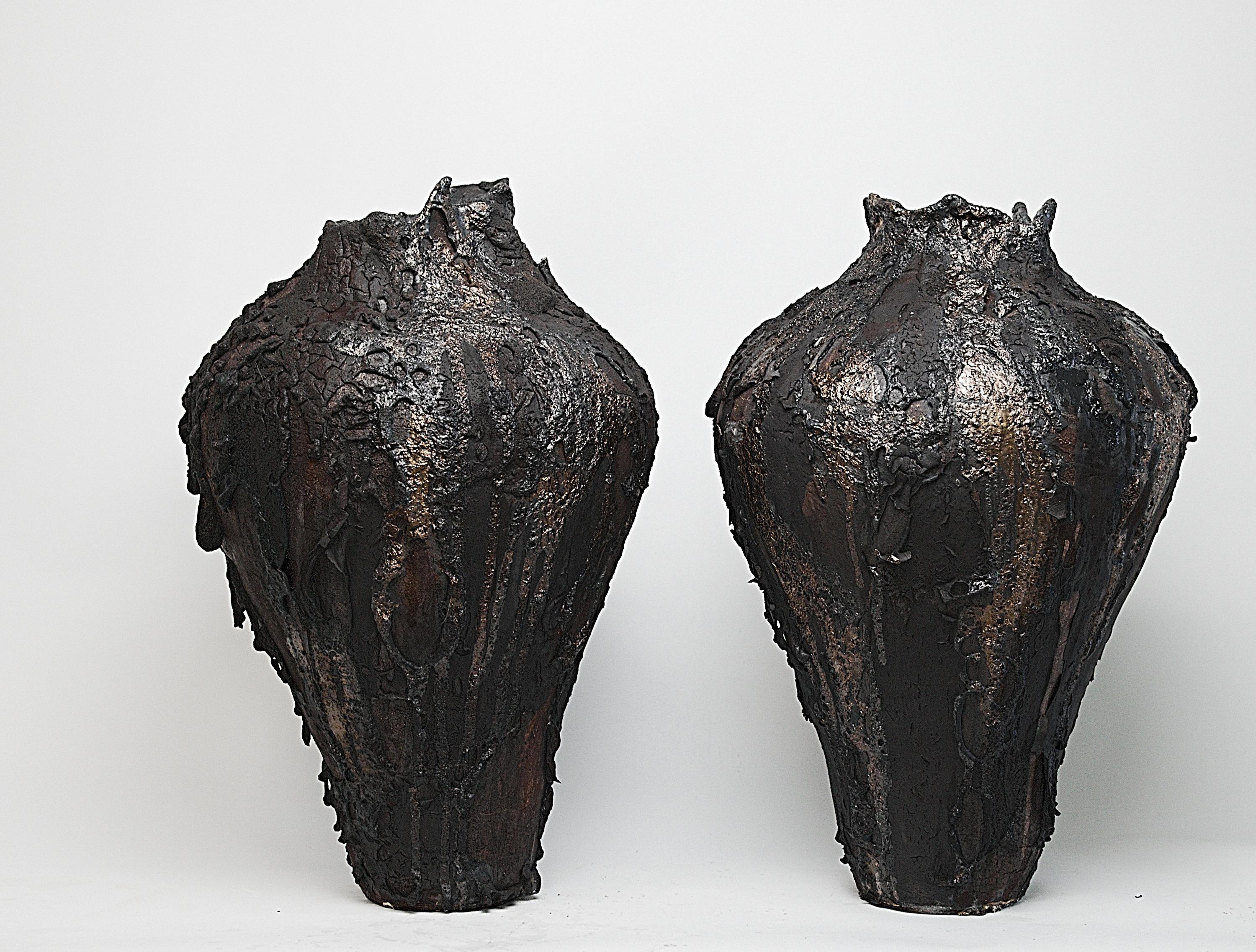 Introducing theMoody Lava Moon Collector, available exclusively at The Shine Studios. This large, hand-coiled vase features a matte finish with layers of heavy clay and slip and added lava glaze texture, embodying the wabi-sabi philosophy of beauty