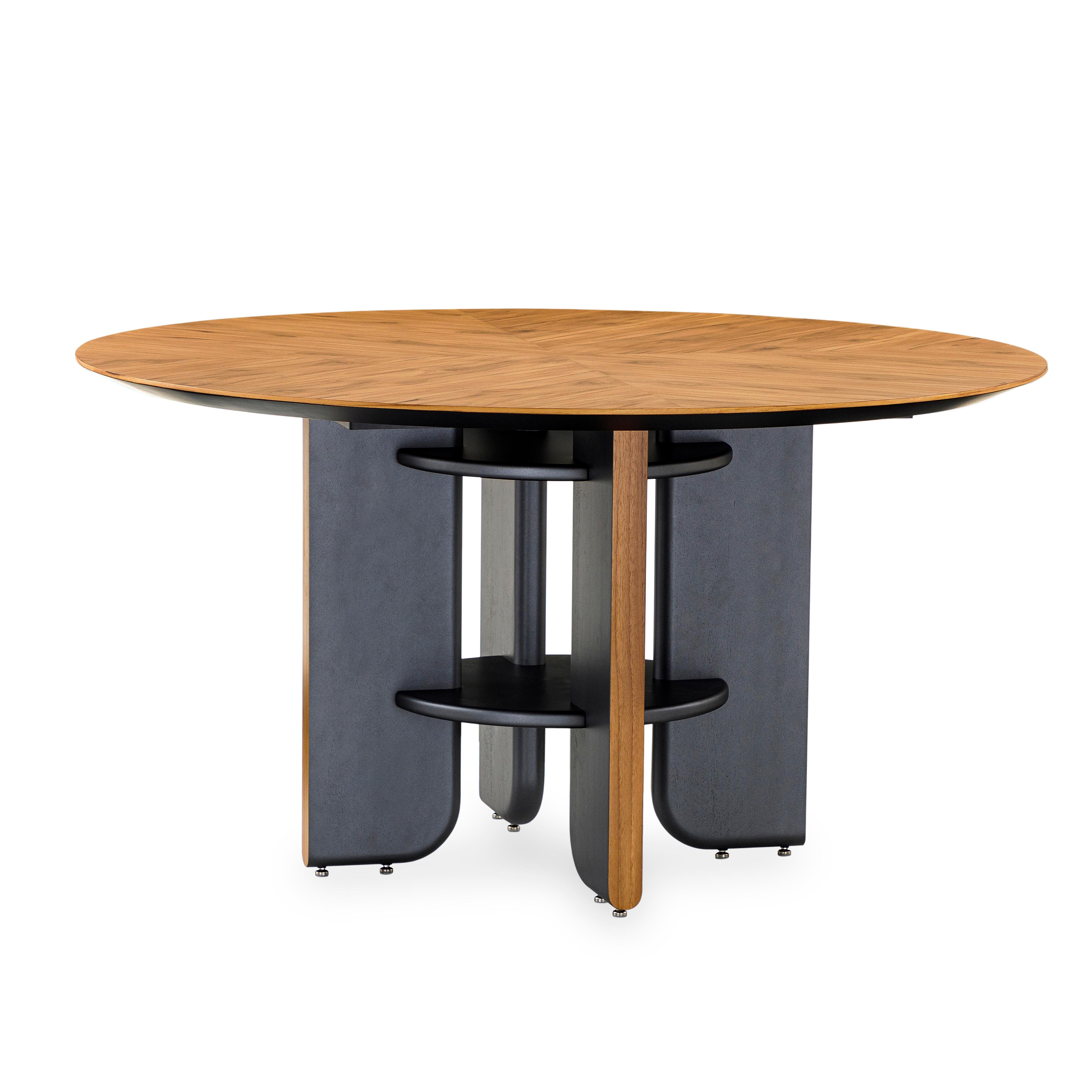 This round dining table in a teak veneered top finish with black wood legs is the perfect table for your house. Every dining space needs a good dining table and the Moon round table is going to be perfect for that space, with an exclusive design and