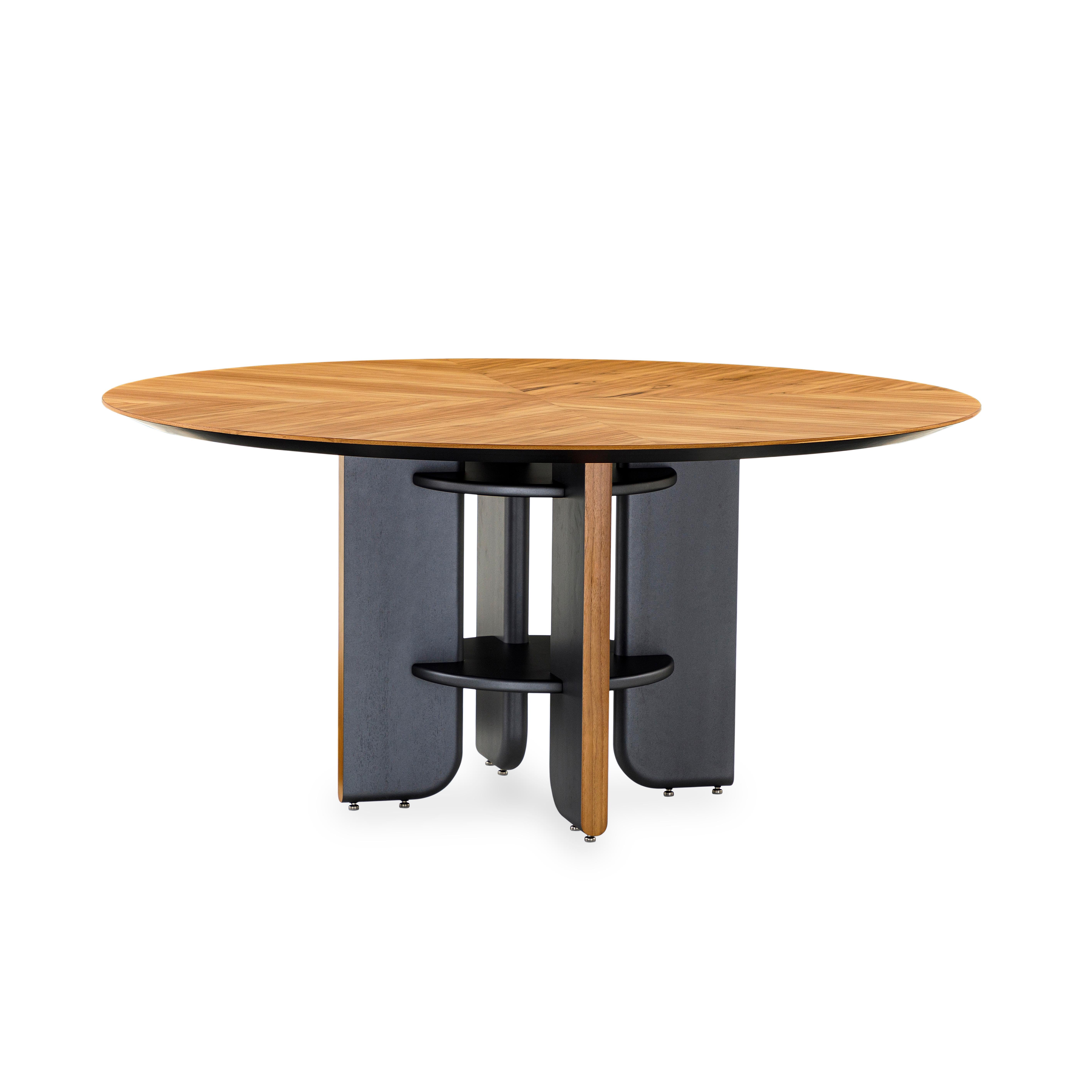 This round dining table in a teak veneered top finish with black wood legs is the perfect table for your house. Every dining space needs a good dining table and the Moon round table is going to be perfect for that space, with an exclusive design and