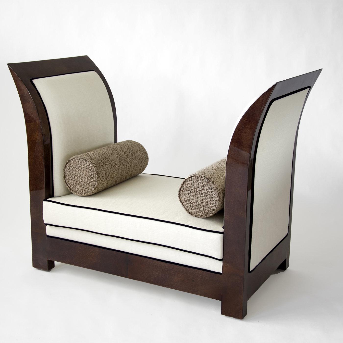 Sculptural and sophisticated, this stunning bench features a rectangular silhouette with tall, curved sides finished with parchment in a matte mocha color (col. 106). The seat cushion and sides (both internal and external) are upholstered in ivory