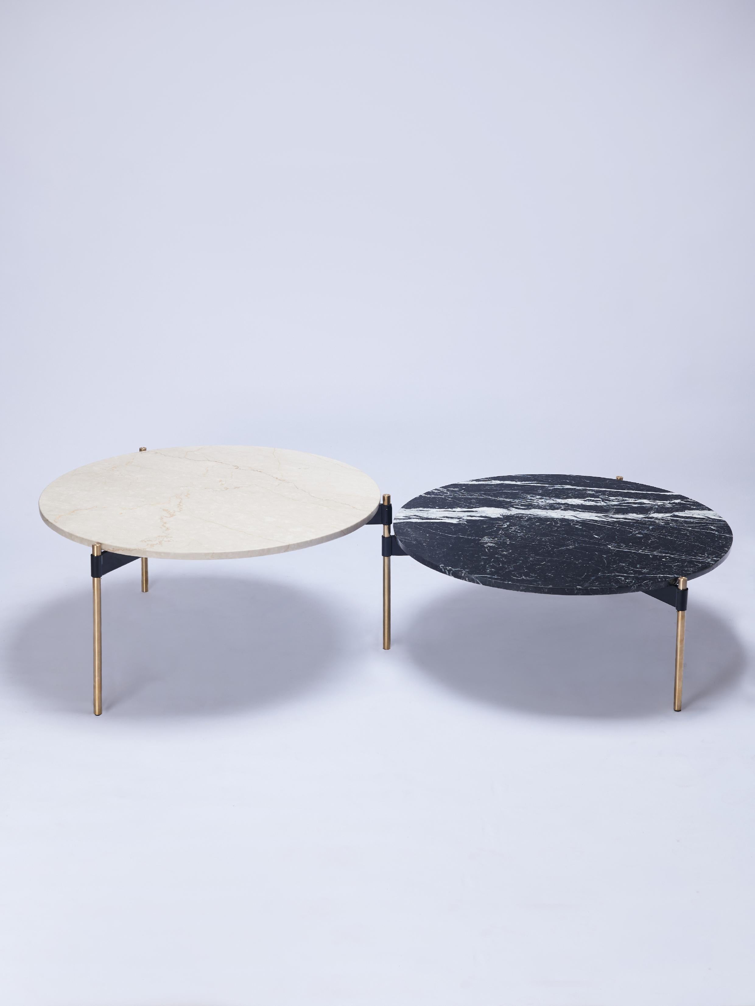 Moon is a single coffee table conformed by three round tops, which by rotating on the axis of the leg they share with its adjacent top, allows different configurations to be formed.

This version of the table features different marble top types,