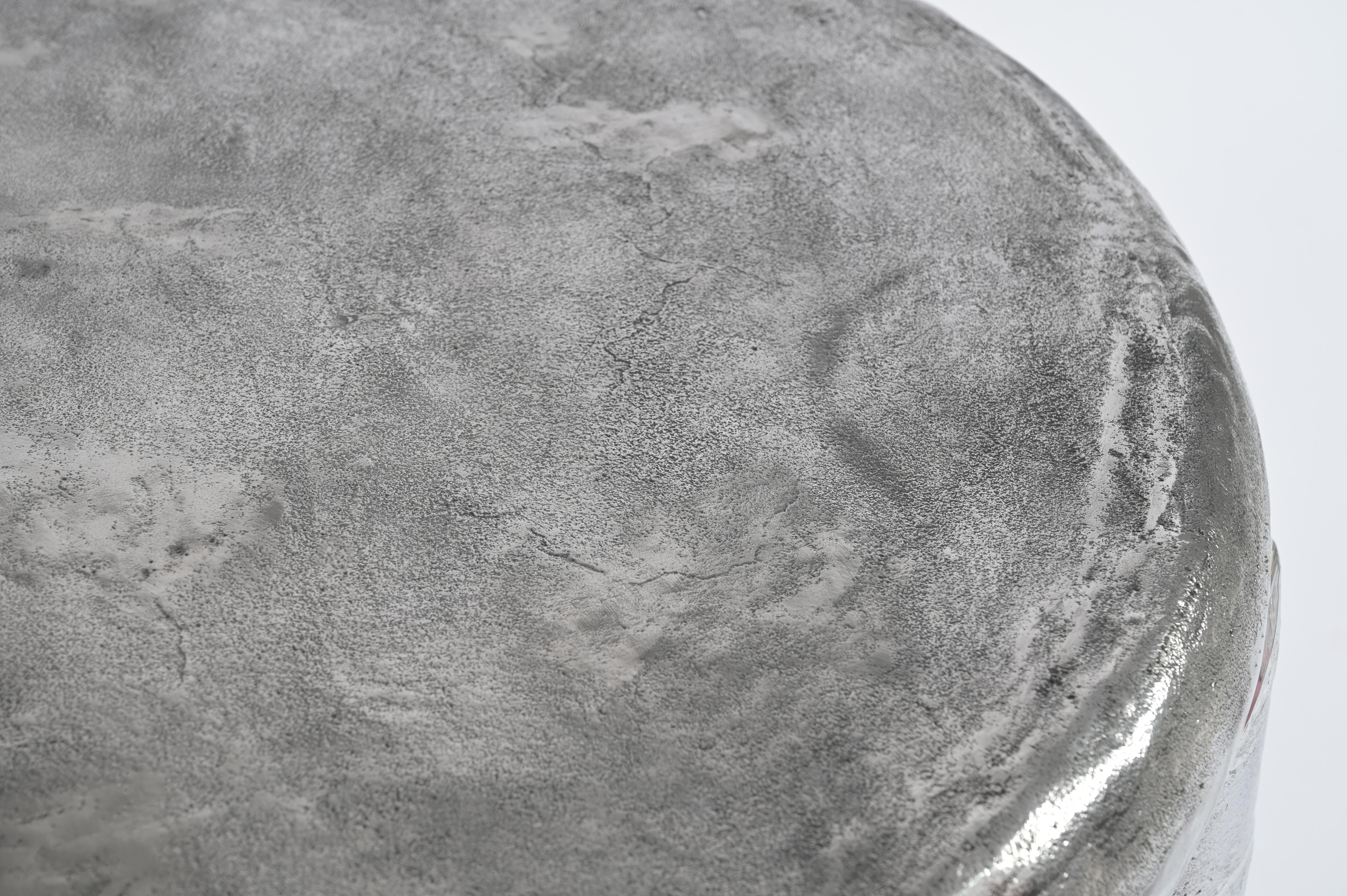 Inspired by the moon, its shape and textures, the moon table visualises the moon in a cast aluminium form. The table has all the textures, hills and valleys, a variety of textures, as their are on the moon. serene, calm, and a lot of visual play.