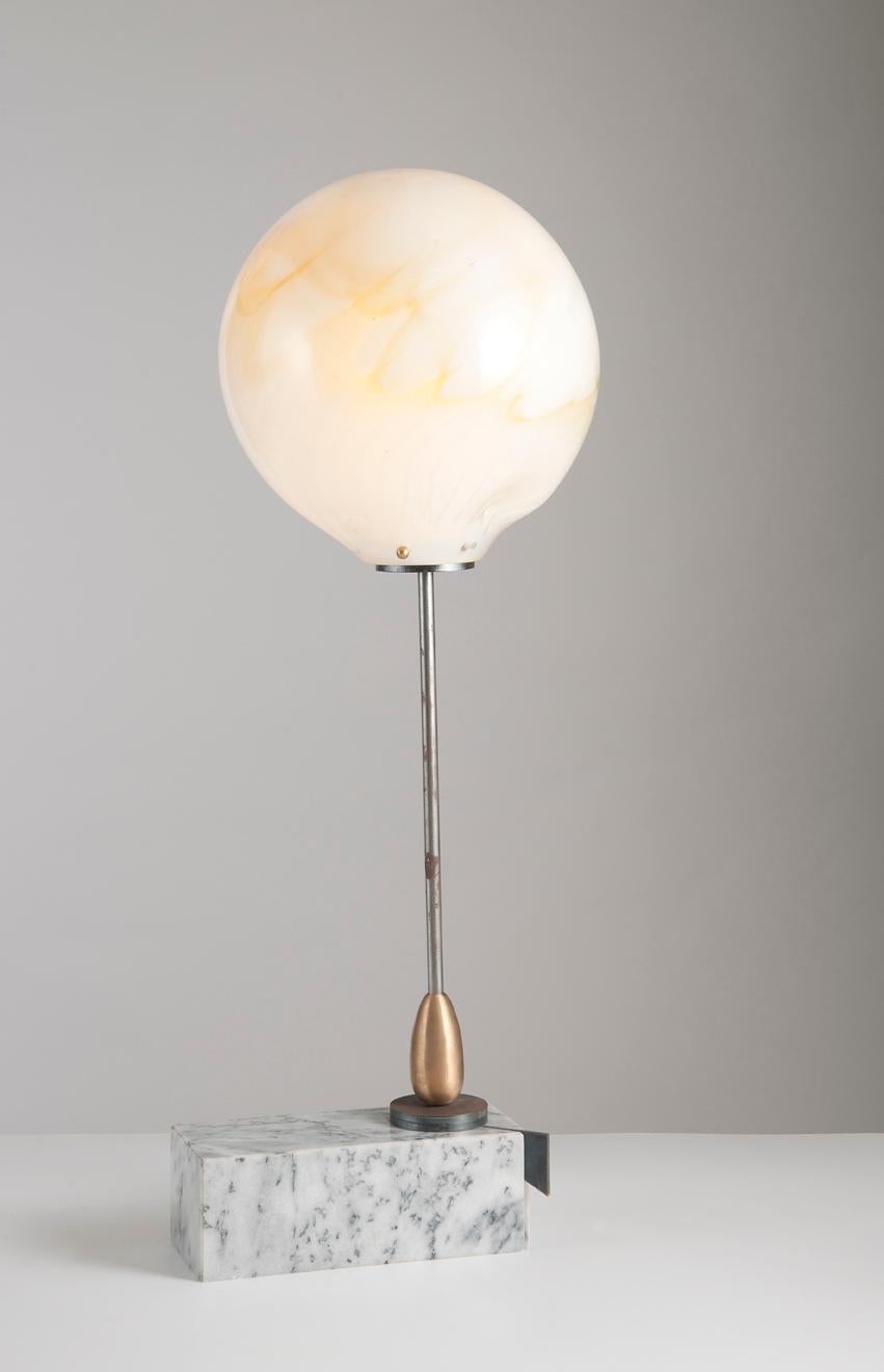 Moon lamp by Sema Topaloglu
Dimensions: 25 x 40 x 105 cm
Materials: base in marble, structure in iron with details in brass and shade in handblown glass

Sema Topaloglu is known for her dedication to materials, craftsmanship and a unique