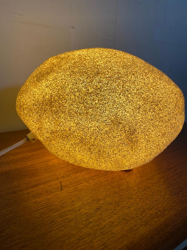 Take me to the moon and back! French designer André Cazenave‘s aim was to bring people closer to nature. He designed this moon rock lamp with a finish of marblepowder and fulfilled his aim. This lamp seems specially made to play a shining role in an