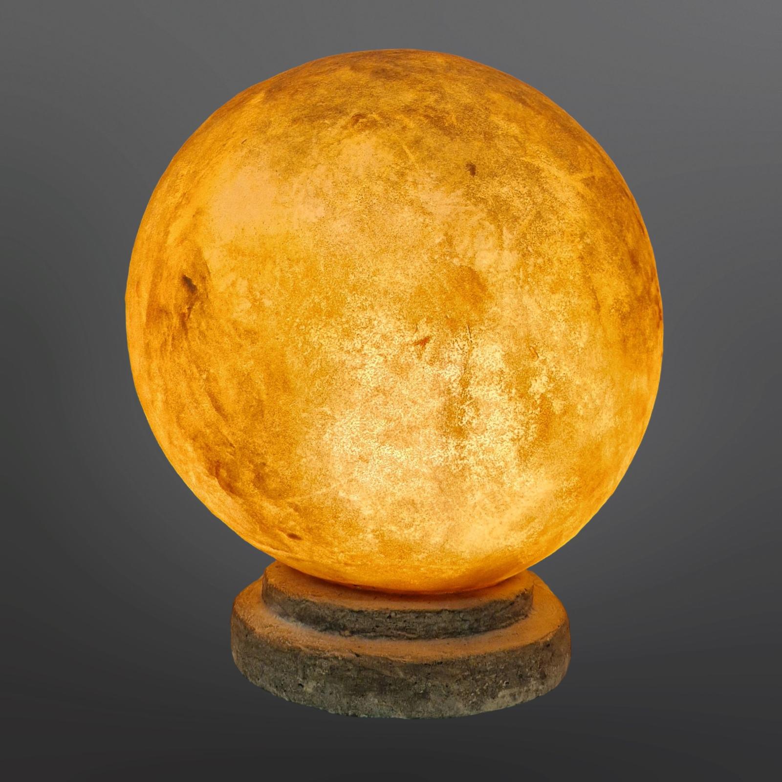 Space age table lamp. In the style of the moon rock lamp series by Andre Cazenave. The globe is made from fiberglass with ground mineral powder giving it a moon like appearance in both the off and on situation. The lamp emits a stunning warm and