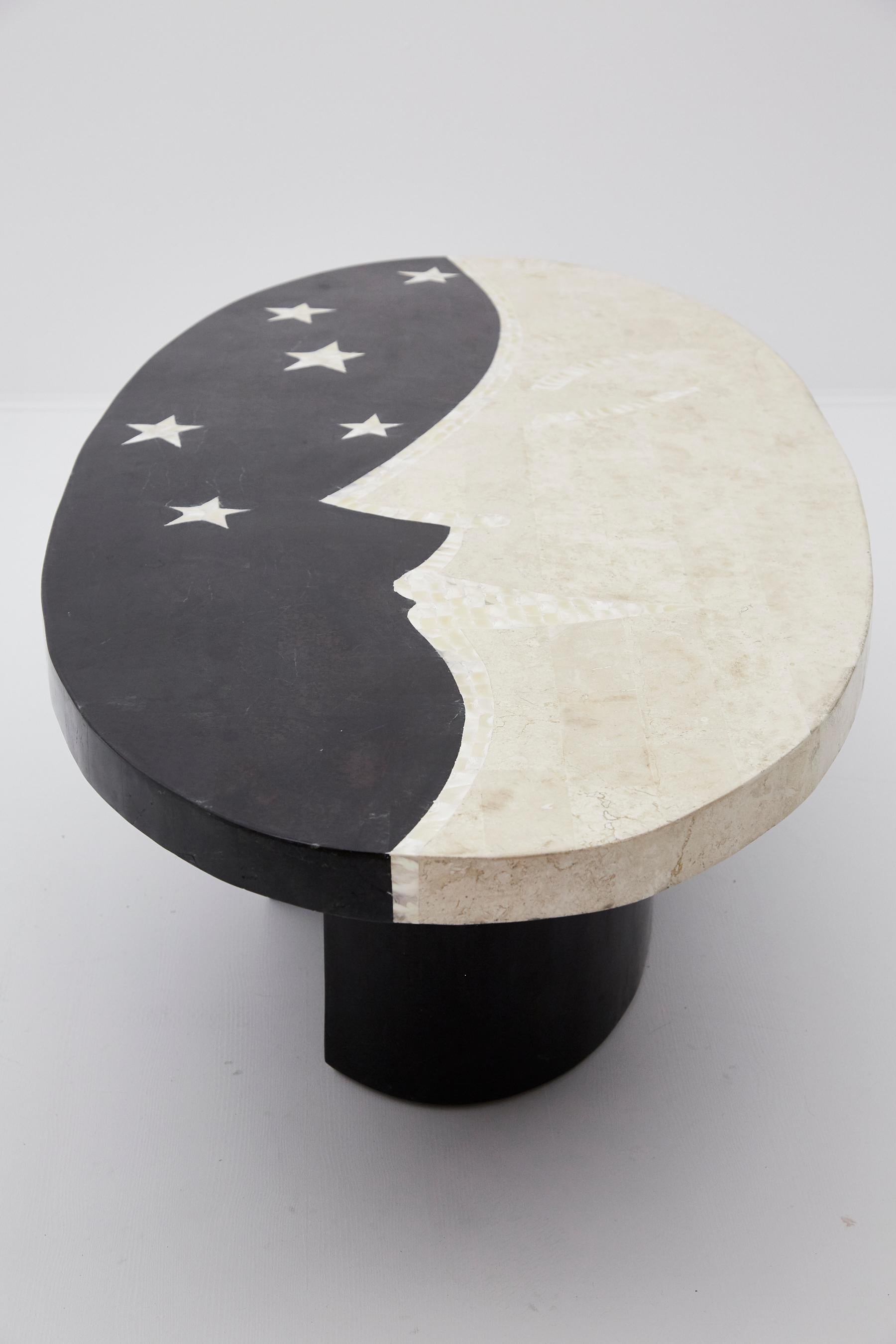 Tessellated black stone, white ivory stone and trocca shell hand inlaid into a charming half moon and stars design over fiberglass body. Oval shaped top with two part semicircle base.