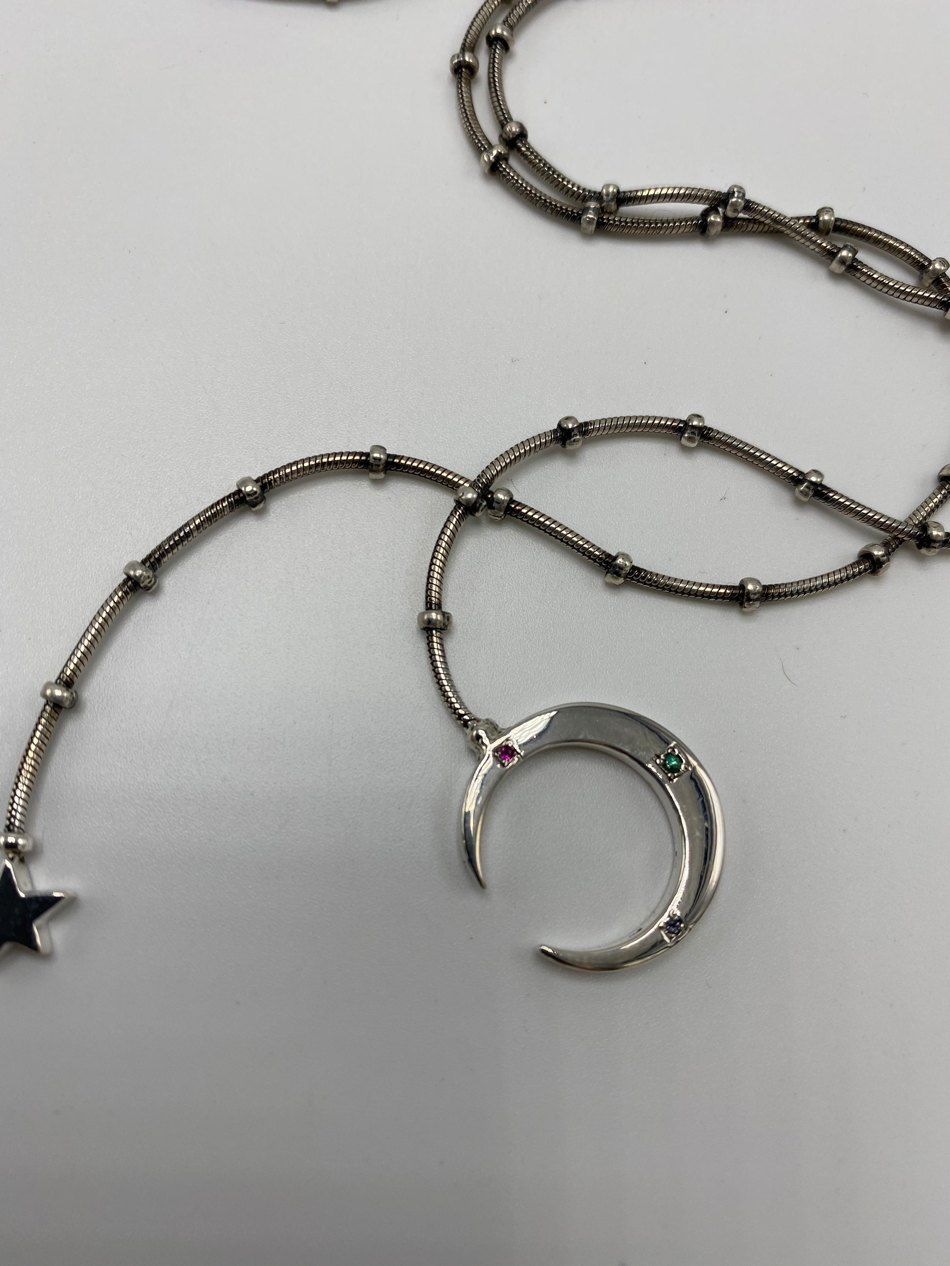 Collar Estrella Lunar Cadena de Plata Granate Verde Rubí Tanzanita Media Luna 

La palabra 