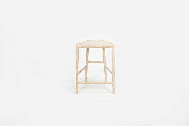 Sun at Six is a contemporary furniture design studio that works with traditional Chinese joinery masters to handcraft our pieces using traditional joinery. The moon stool is a counter stool named for its moon-shaped seat. This stool is crafted with