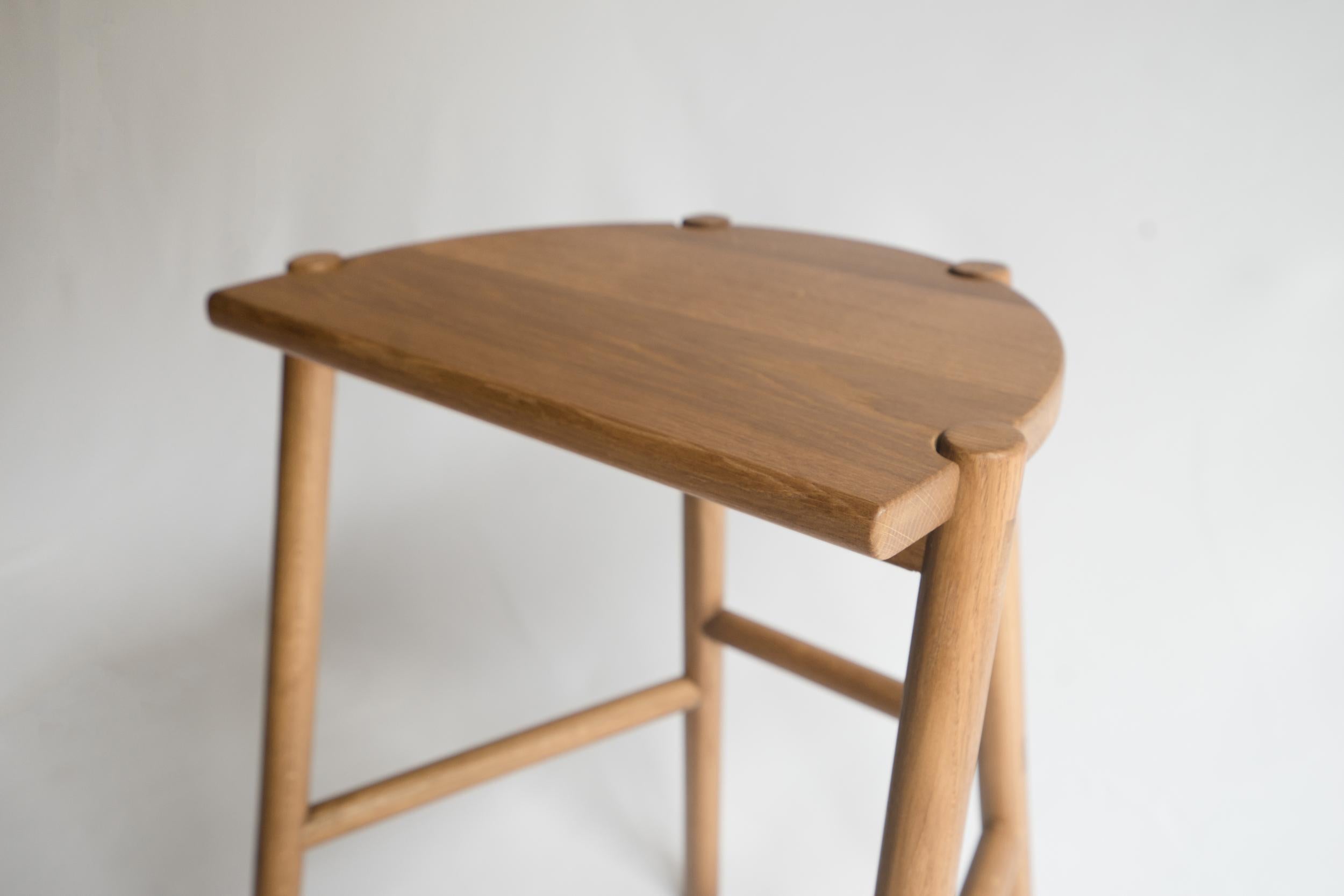 Sun at Six is a contemporary furniture design studio that works with traditional Chinese joinery masters to handcraft our pieces using traditional joinery. The moon stool is a counter stool named for its moon-shaped seat. This stool is crafted with