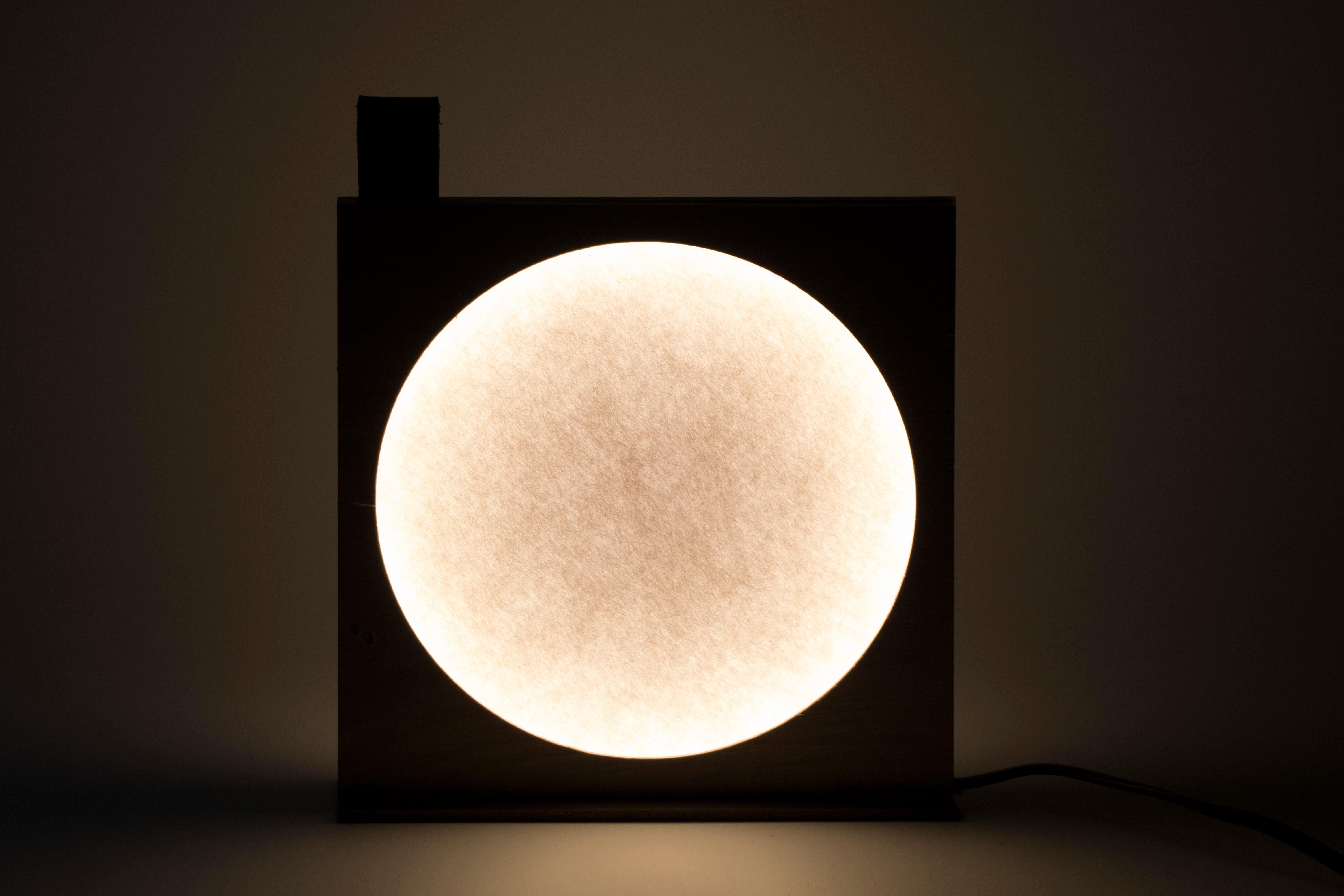 Moon Table Lamp by KNGB
Dimensions: W 20 x H 20 cm
Material: Wood, LED LED 2700°k 7w integrated.

KNGB, design studio has been based in Roubaix since 2014, within the former heart of the textile industry. We specify our style and artisanal know-how