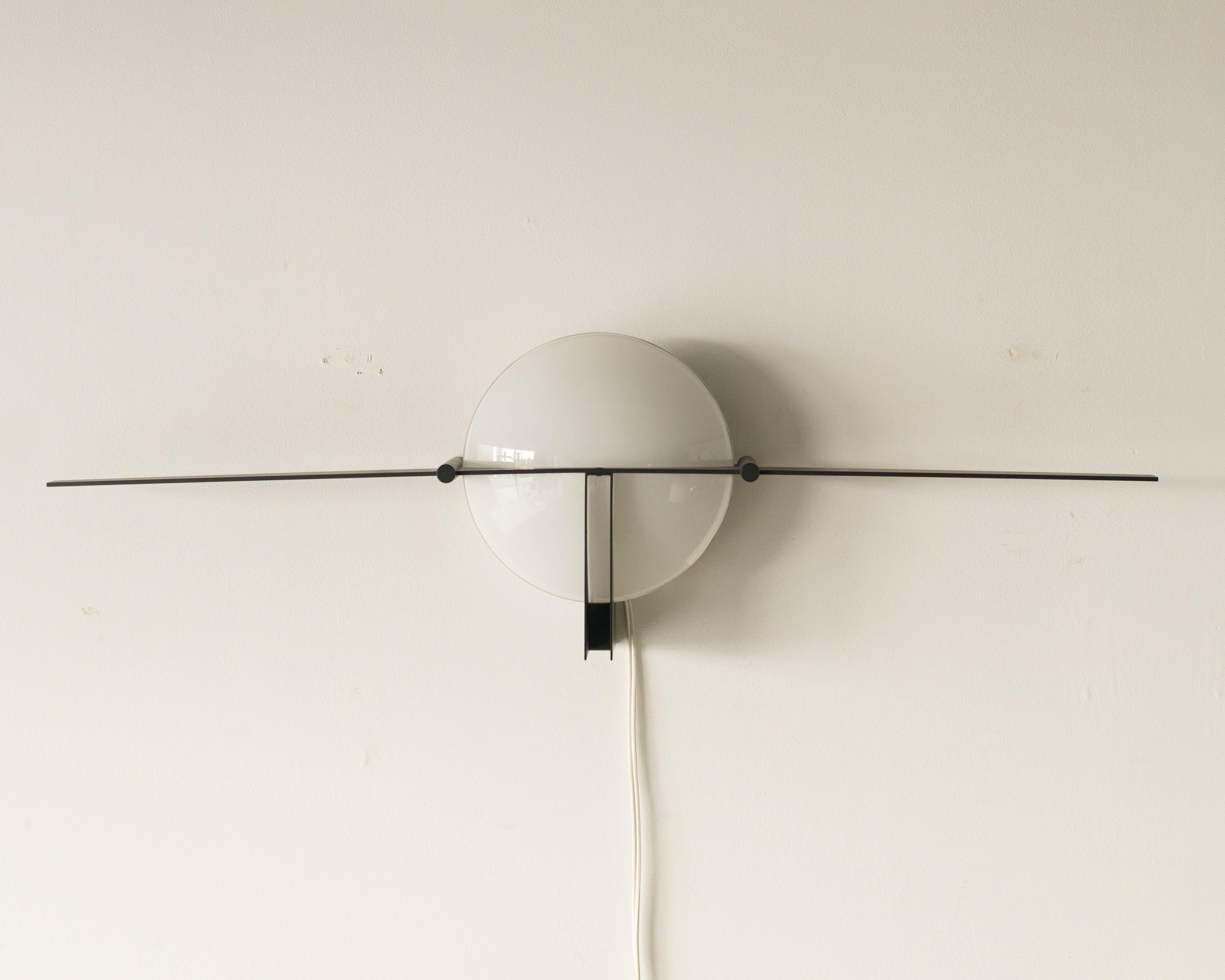 Wall lamp by Jean Michel Wilmotte. Probably made in 1980s or early 1990s.
Steel frame with white glass shade.