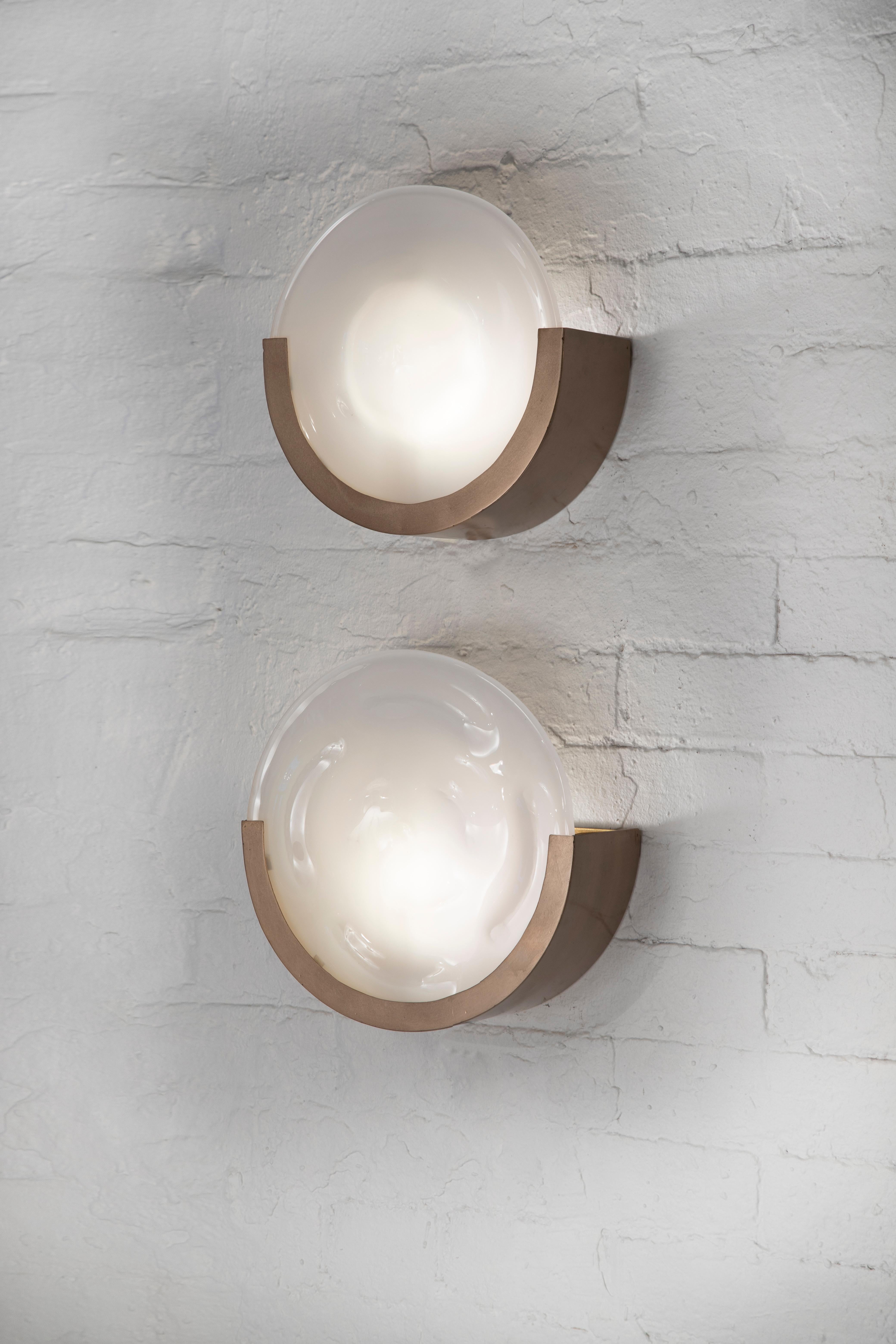 Inspired by the glow of the full moon, this original, organic modernist design is crafted entirely by hand and features a cast glass diffuser set in a bronze 