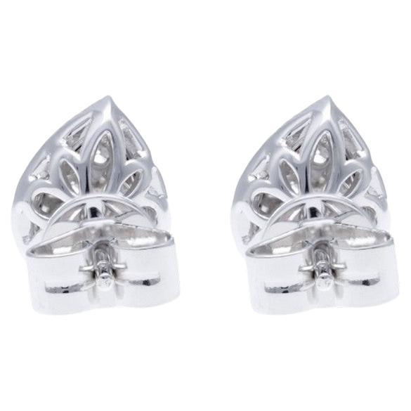 Diamond Total Carat Weight: These elegant studs feature a total carat weight of 0.58 carats, comprised of a cluster of 56 round diamonds.

Diamonds: The studs showcase a stunning arrangement of 56 round diamonds, meticulously set to form a