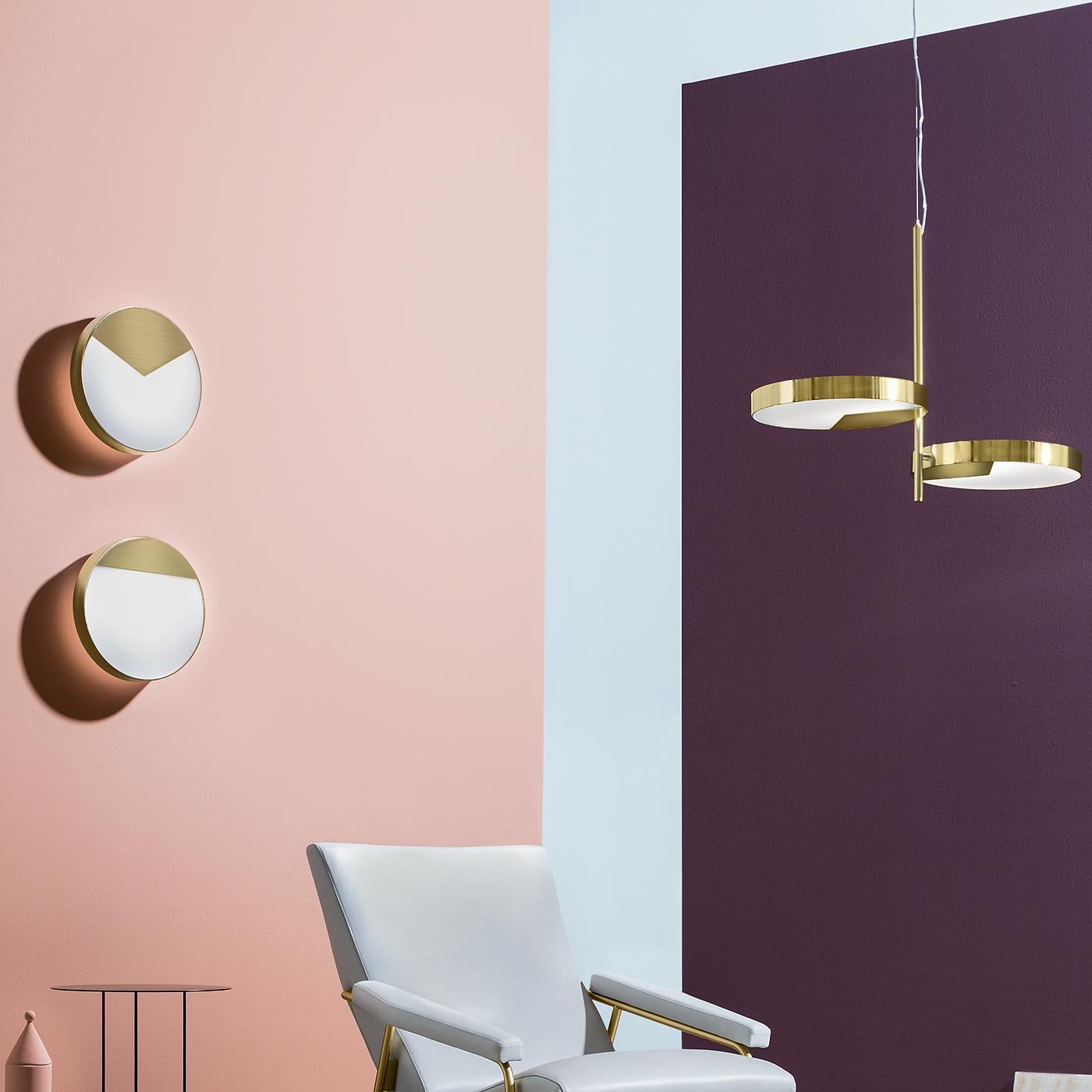 Exuding restrained and timeless elegance, the Moonlight sconce by Matteo Zorzenoni is a versatile object of decor suitable for both modern and eclectic interiors. The round metal structure shares the polished brass finish with a semi-circular metal
