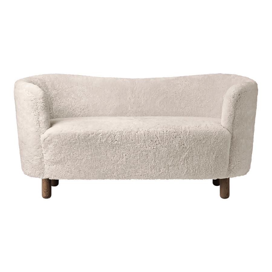 Moonlight sheepskin and smoked oak mingle sofa by Lassen.
Dimensions: W 154 x D 68 x H 74 cm. 
Materials: sheepskin, oak.

The Mingle sofa was designed in 1935 by architect Flemming Lassen (1902-1984) and was presented at The Copenhagen