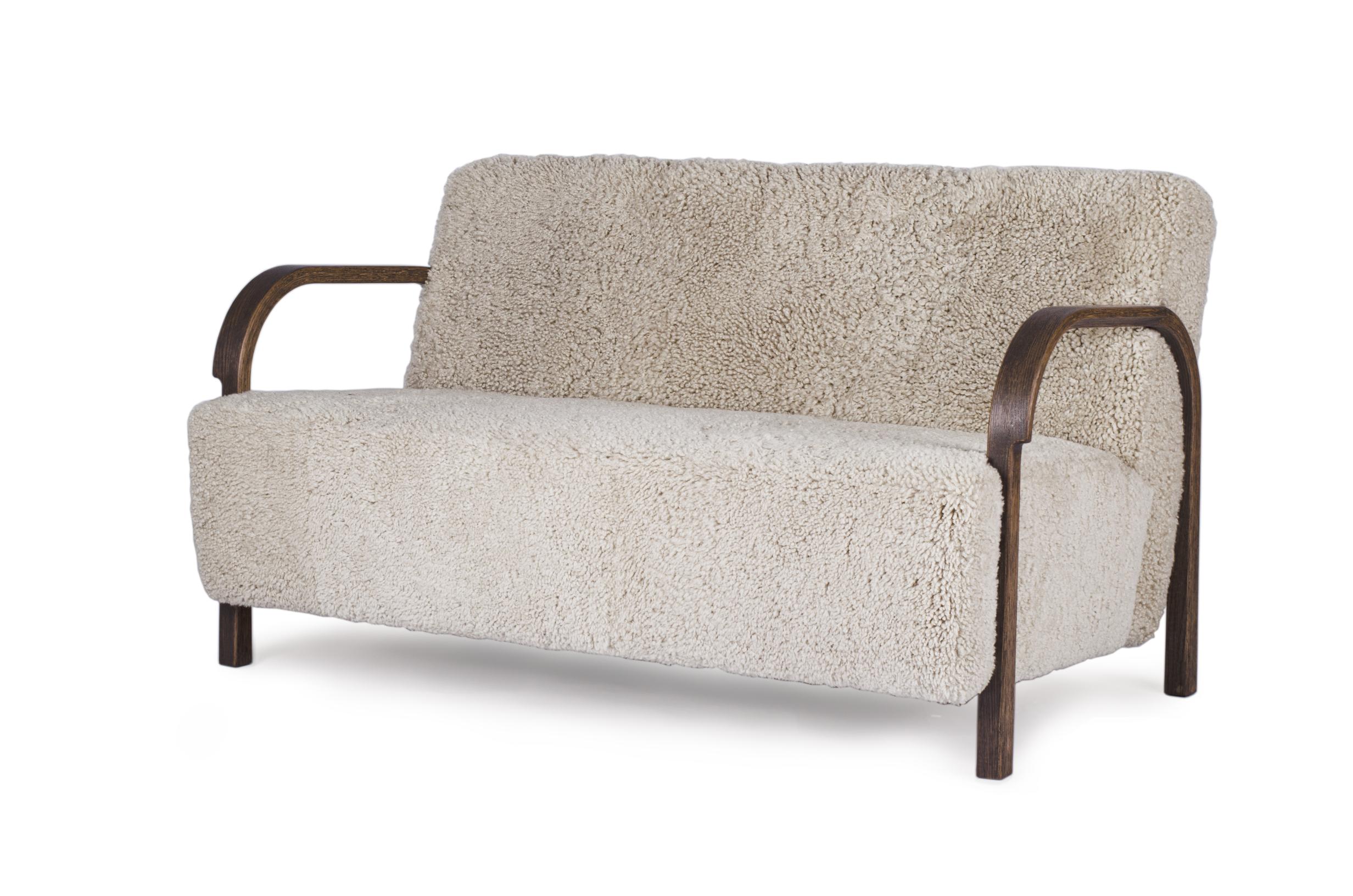 Moonlight Sheepskin ARCH 2 Seater Sofa by Mazo Design
Dimensions: W 128 x D 79 x H 76 cm
Materials: Oak, Sheepskin
Also Available: 2 Seater Configuration, ROMO/Linara, DAW/Royal, KVADRAT/Remix, KVADRAT/Hallingdal & Fiord, BUTE/Storr,