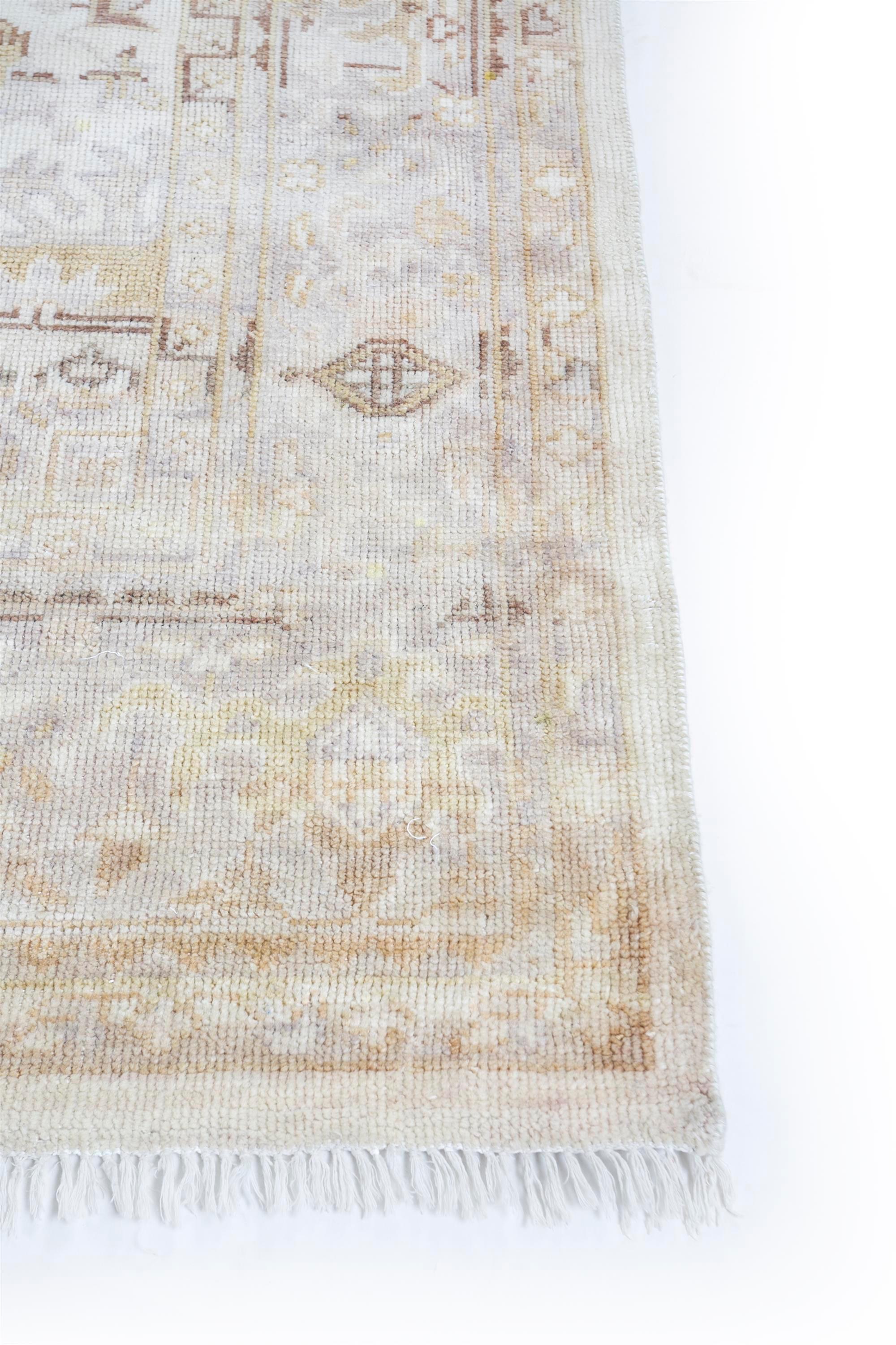 Step into the realm of serene complexity with this handwoven wool rug from our Viscaya collection. The standout feature of this rug lies in its elaborate pattern, meticulously hand-knotted to create a detailed and textured masterpiece. The delicate