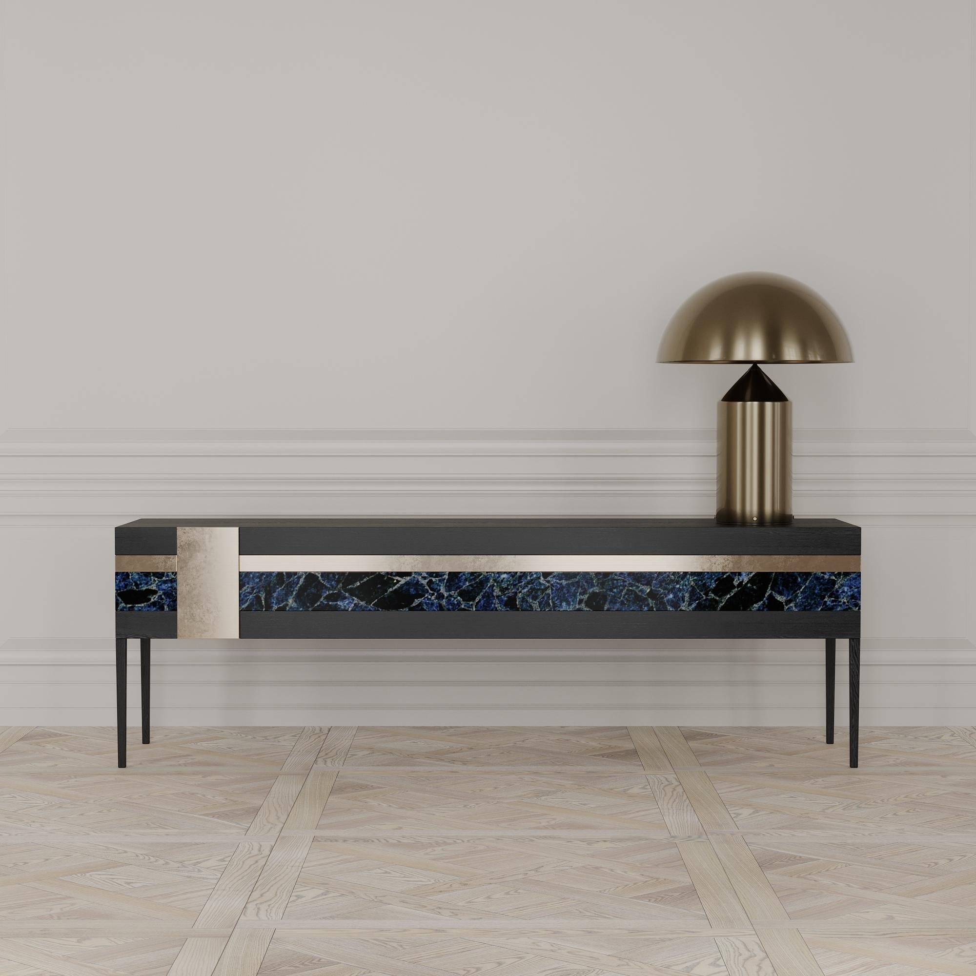 The Moonrise credenza is designed by Emél & Browne in the Minimalist and contemporary style and custom made in Italy by skilled artisans.

The semi-precious gemstone panel of the Moonrise credenza instills the quality of light at dusk. The agate
