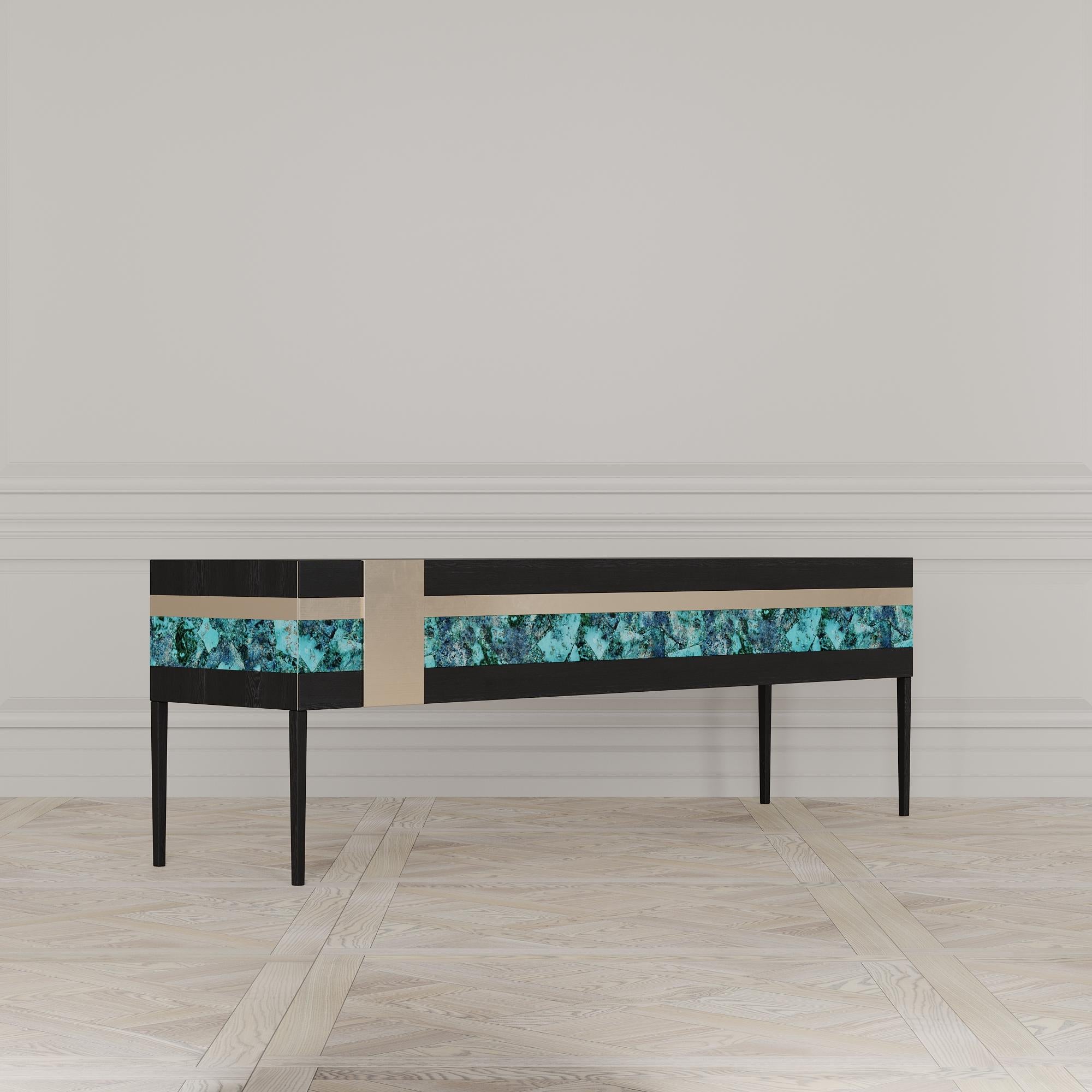 The Moonrise credenza is designed by Emél & Browne in the Minimalist and contemporary style and custom made in Italy by skilled artisans.

The semi-precious gemstone panel of the Moonrise Credenza instills the quality of light at dusk. The agate