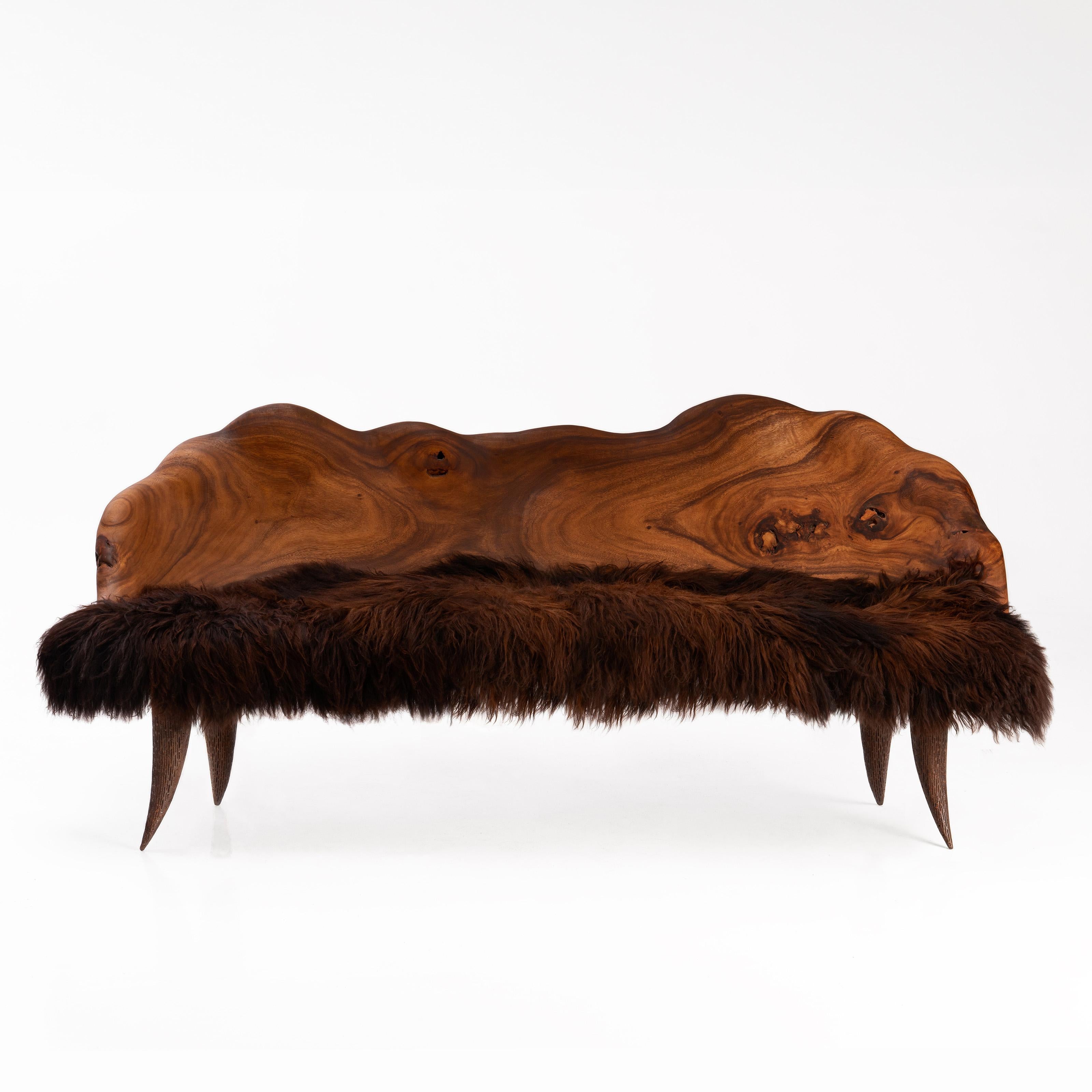 Moonrise Kingdom Bench by Odditi
Dimensions: W 195 x D 60 x H 100 cm
Materials: Acacia Wood, Sheepskin

The ‘Moonrise Kingdom’ is an organic modern sculptural statement piece. Hand-carved from solid Acacia wood and adorned with luxuriously thick
