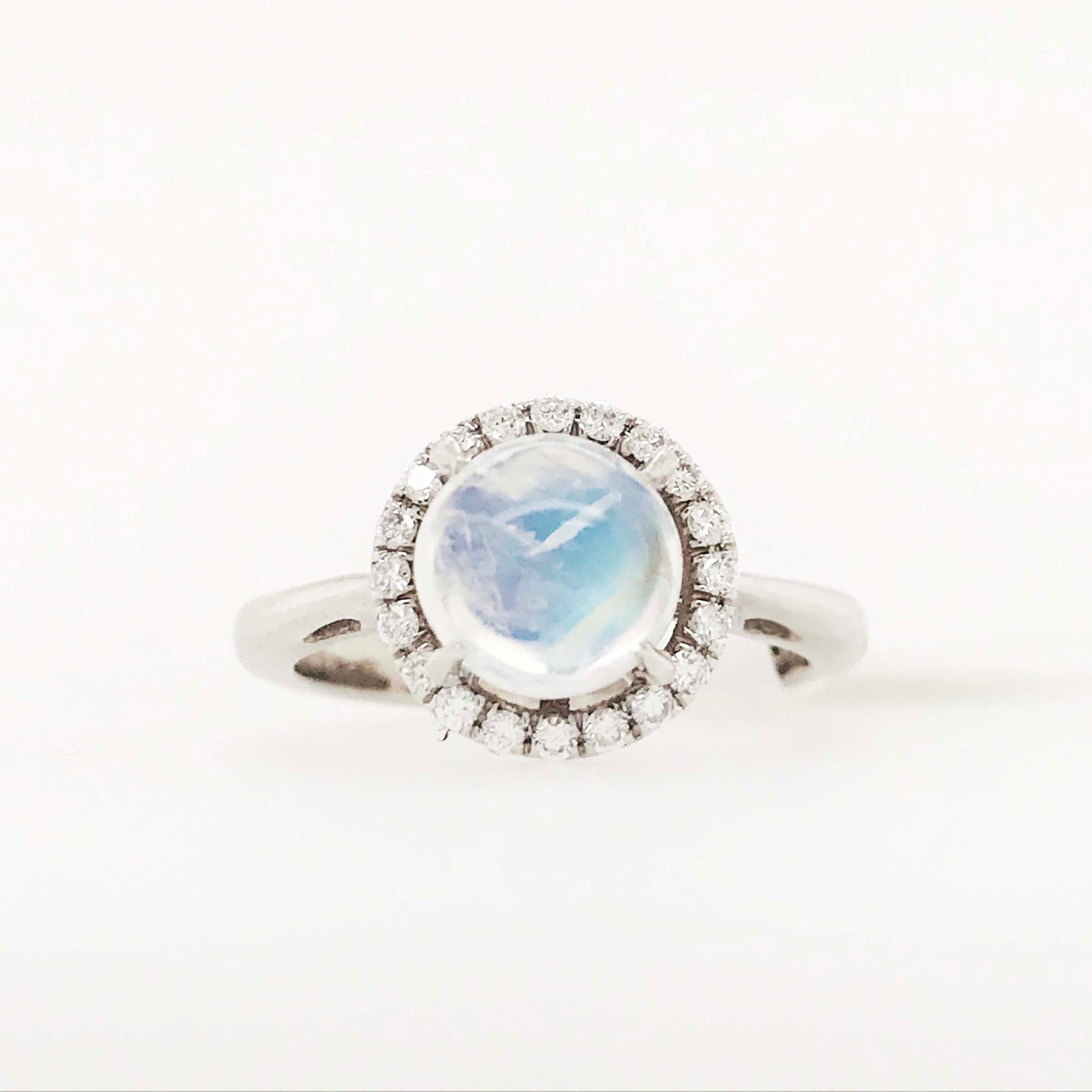 This diamond and moonstone platinum engagement ring is very modern and so unique! With an alternative center stone, the gorgeous rainbow moonstone! The rainbow moonstone is a unique and special genuine gemstone that has a gorgeous iridescence and